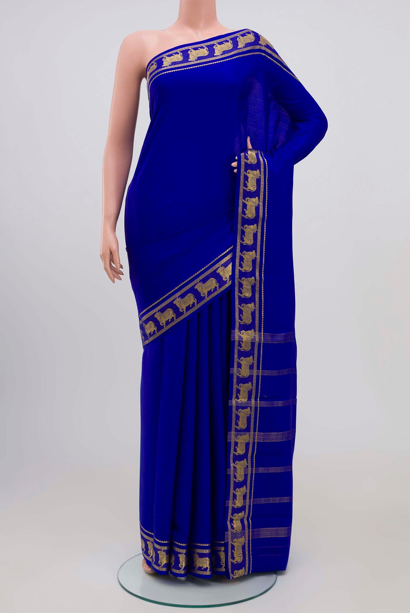 Royal Blue Mysore Crepe Saree with Plain Body and Zari Border.  displayed on a mannequin