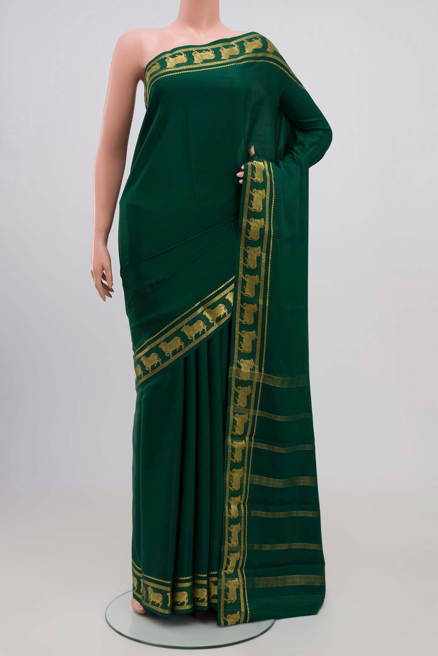 Green Mysore Crepe Saree with Plain Body and Zari Border.  displayed on a mannequin
