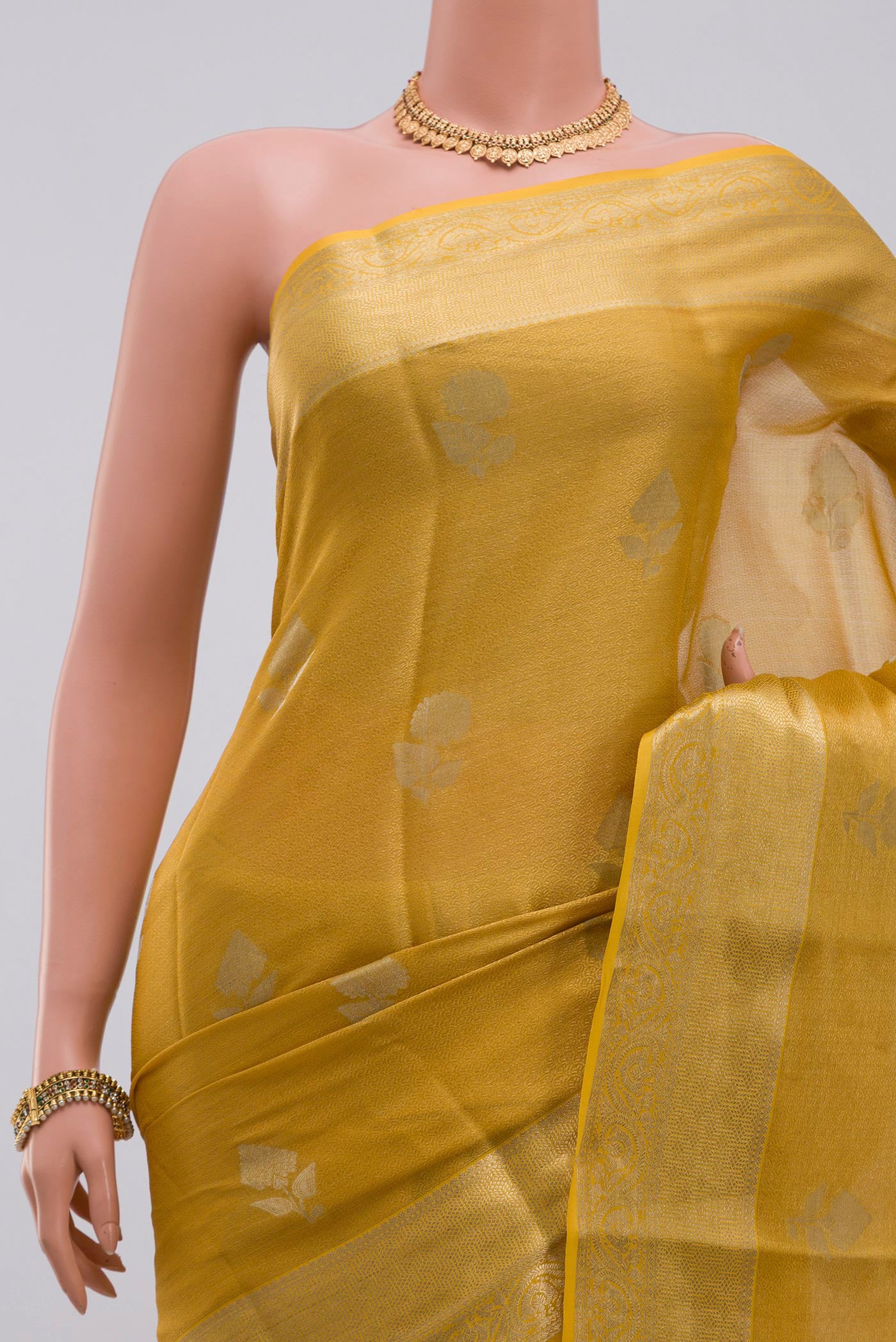 Border image of Golden Georgette Saree with Zari Brocade on the body and Zari Border. 