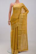 Golden Georgette Saree with Zari Brocade on the body and Zari Border.  displayed on a mannequin
