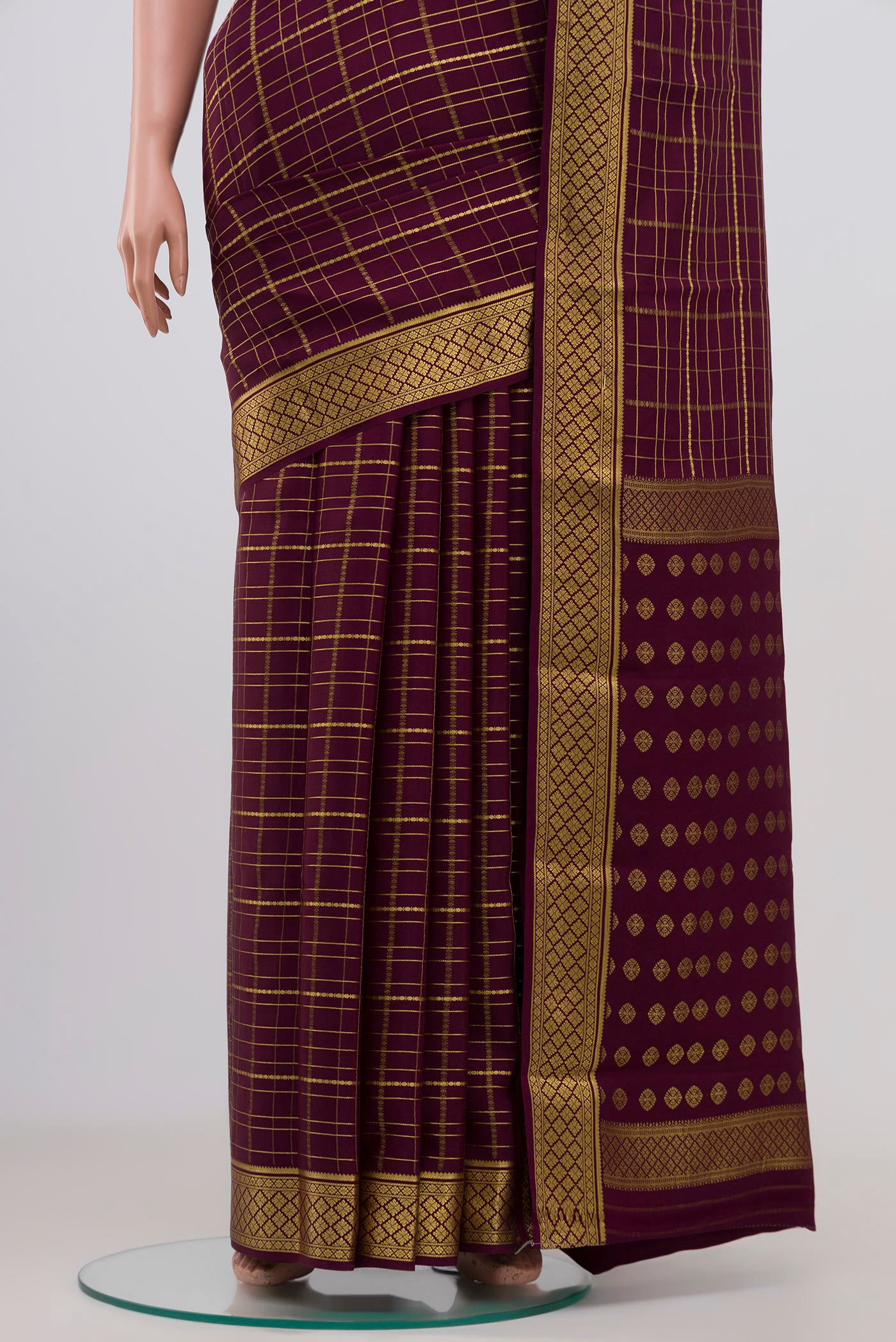 Pleats and pallu of Purple Mysore Crepe Saree with Checked design on the body and Zari Border. 