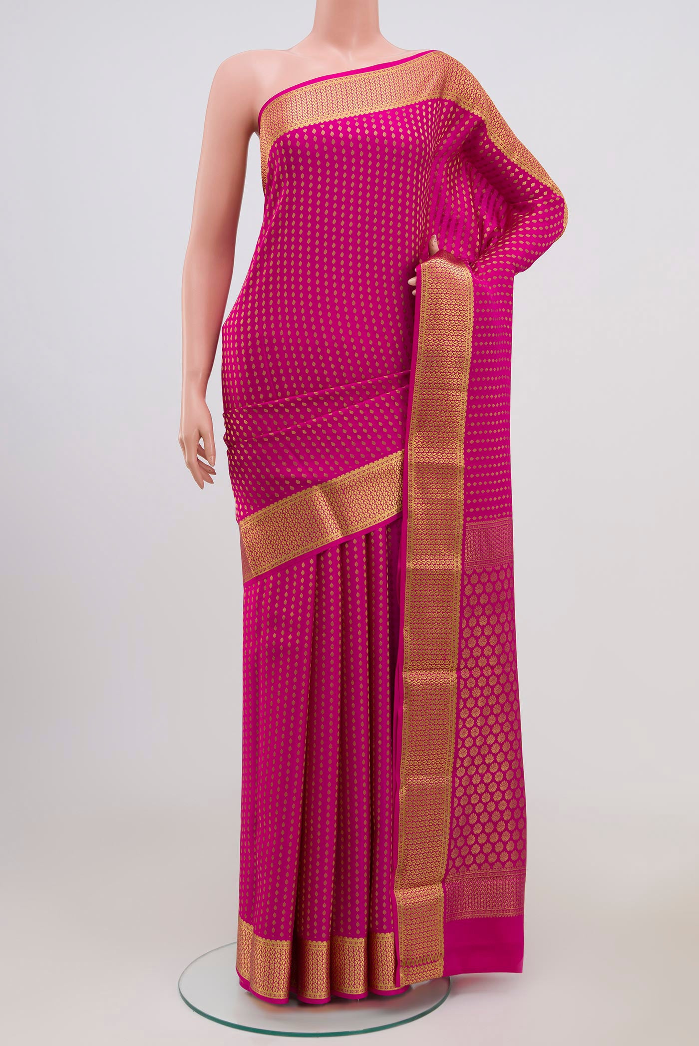 Pink Mysore Crepe Saree with Zari Butta on the body and Zari Border.  displayed on a mannequin