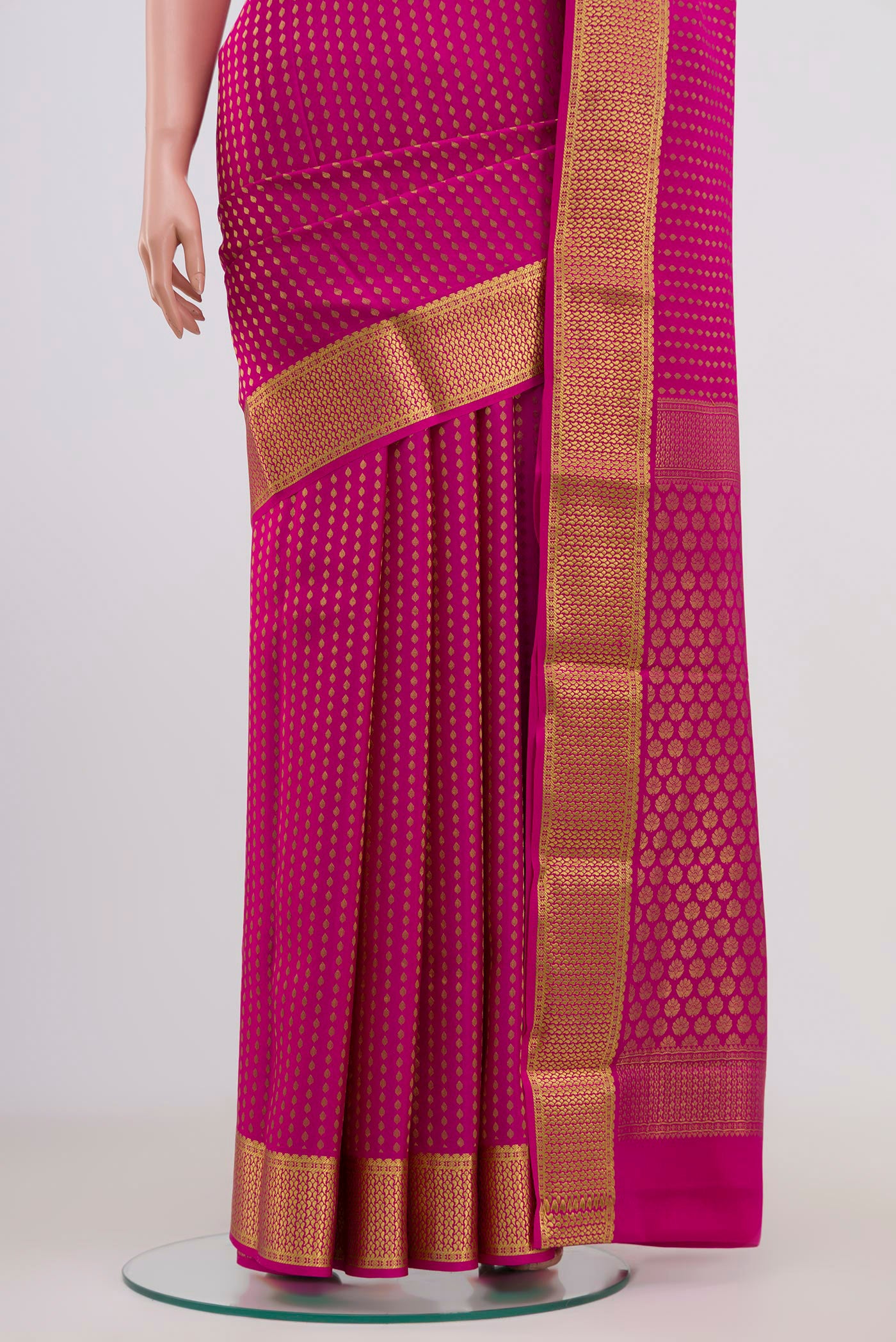 Pleats and pallu of Pink Mysore Crepe Saree with Zari Butta on the body and Zari Border. 