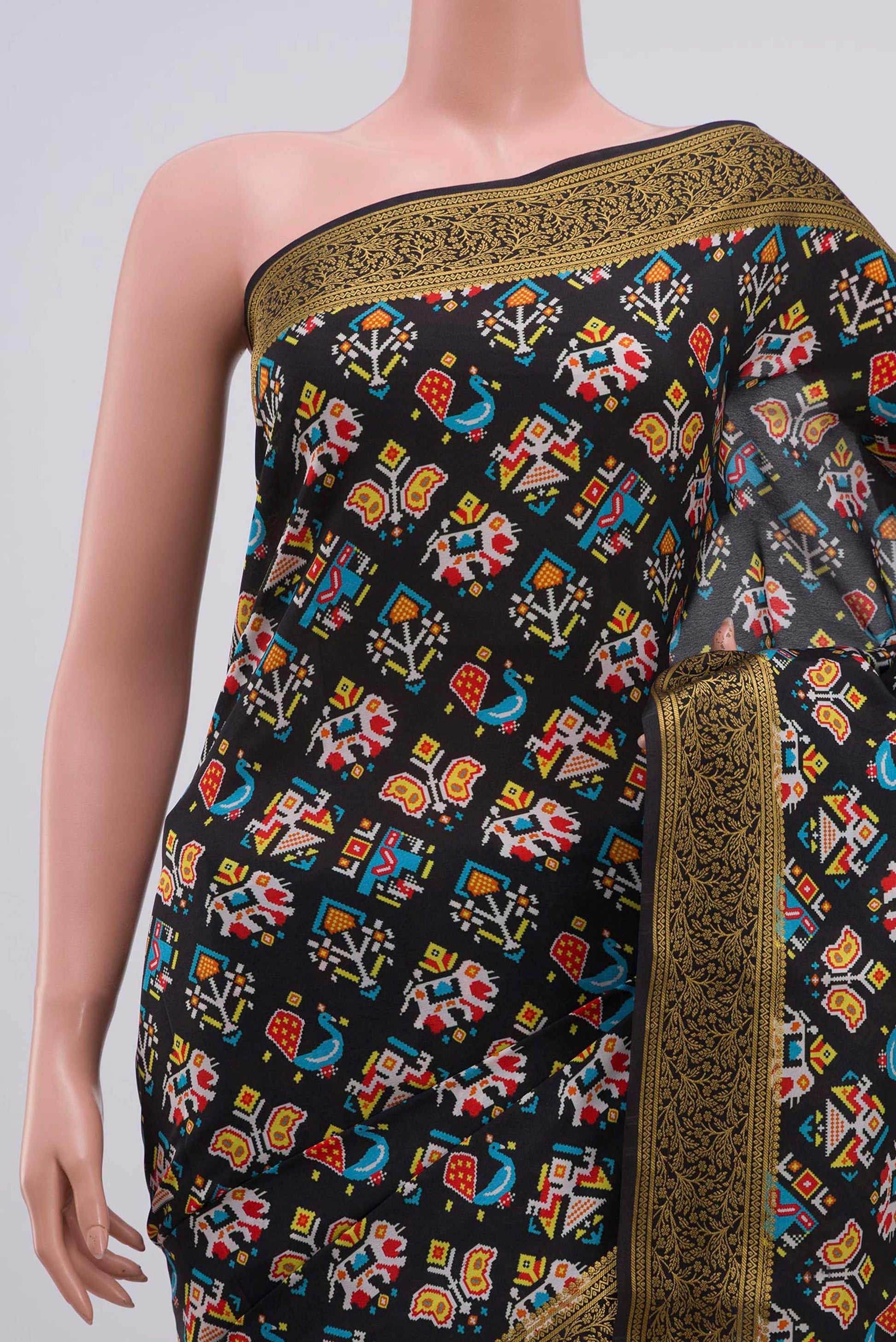 Border image of Black Crepe Saree with Floral Print on the body and Zari Border. 