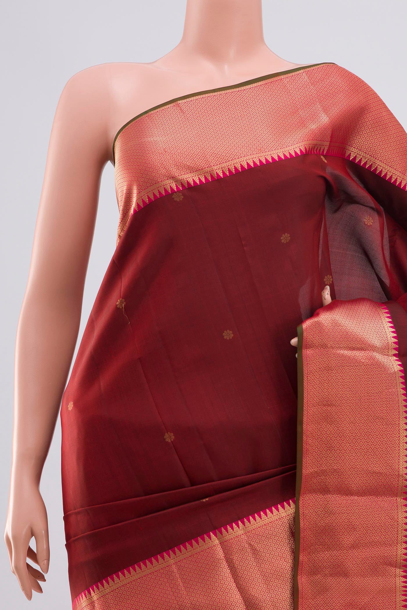 Border image of Maroon Kanchipuram Saree with Zari Butta on the body and Zari Border. 