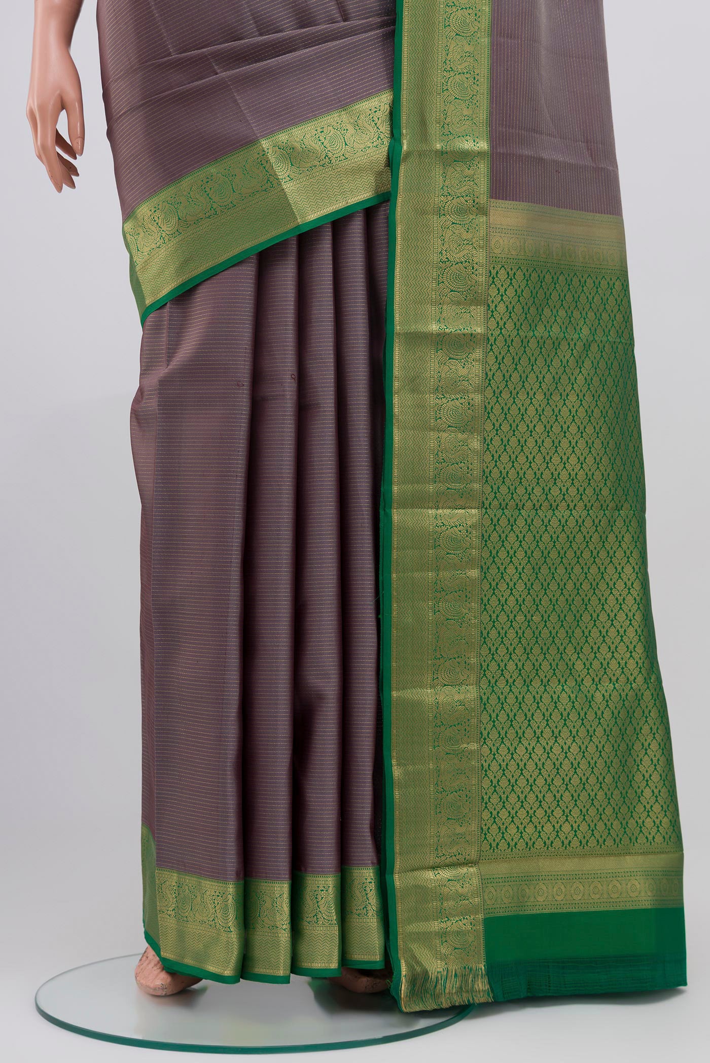 Pleats and pallu of Grey Kanchipuram Saree with Stripes on the body and Zari Border. 