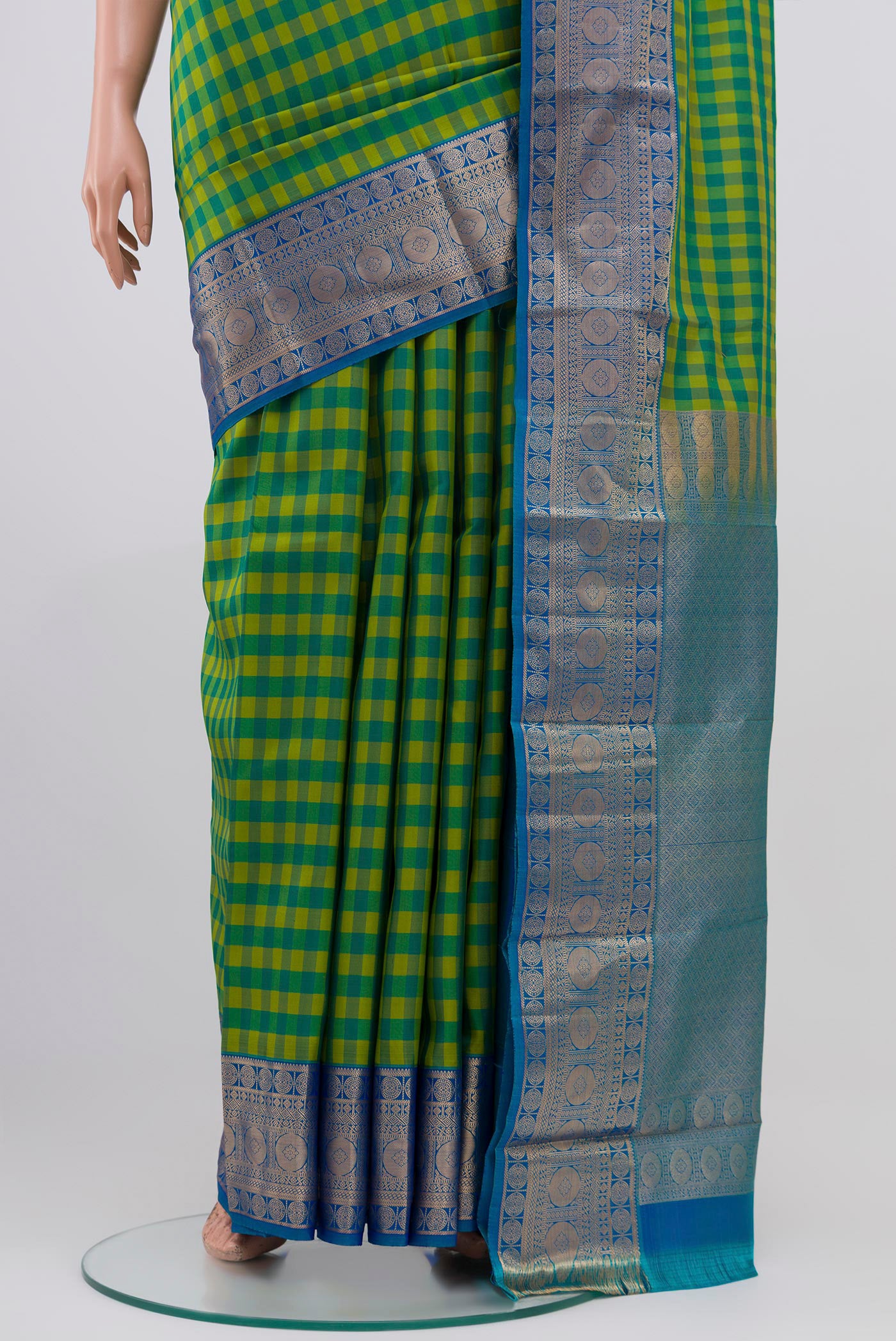 Pleats and pallu of Multi Color Kanchipuram Saree with Checked design on the body and Zari Border. 