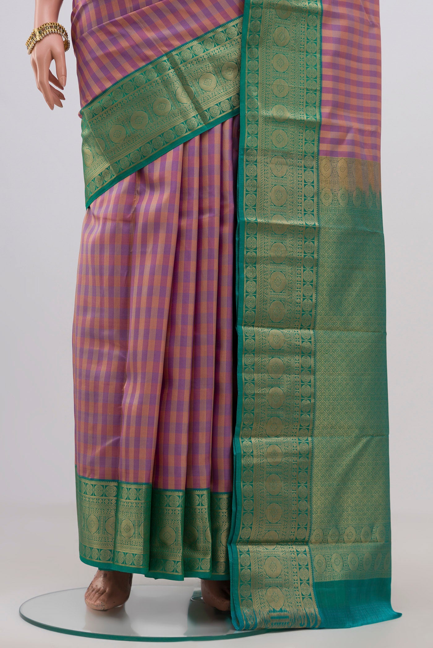 Pleats and pallu of Multi Color Kanchipuram Silk Saree with Checked design on the body and Zari Border. 