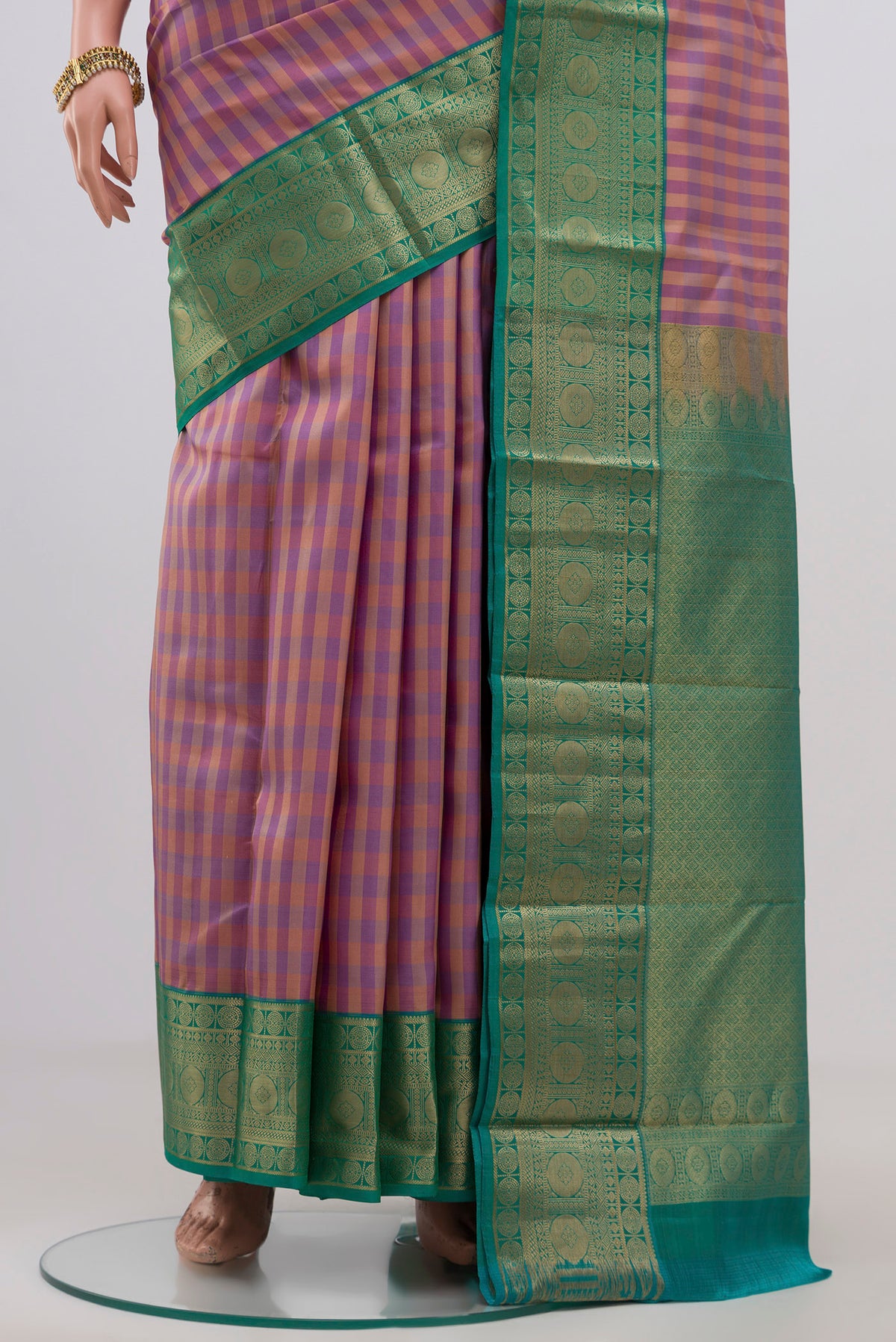 Pleats and pallu of Multi Color Kanchipuram Silk Saree with Checked design on the body and Zari Border. 