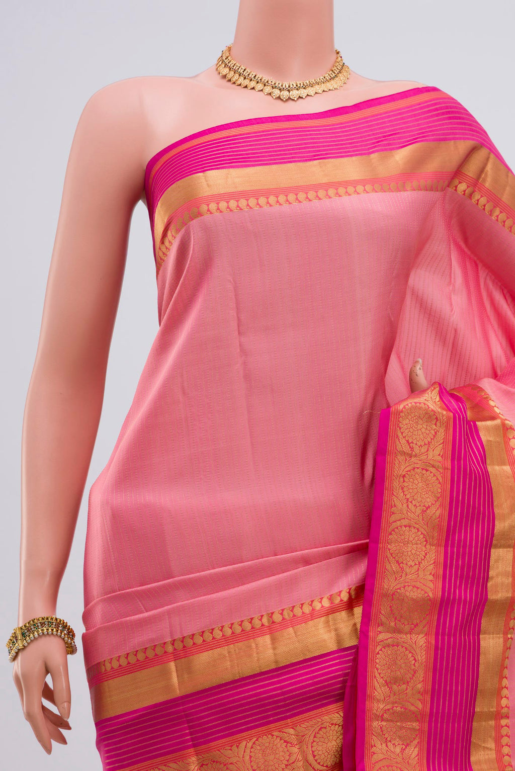Border image of Pink Kanjivaram Saree with Stripes on the body and Zari Border. 