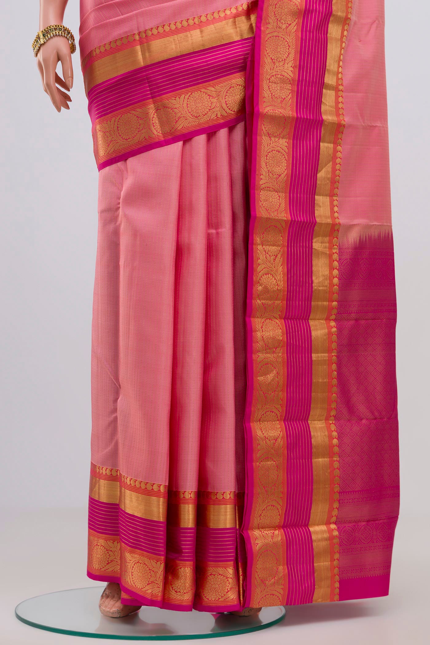 Pleats and pallu of Pink Kanjivaram Saree with Stripes on the body and Zari Border. 