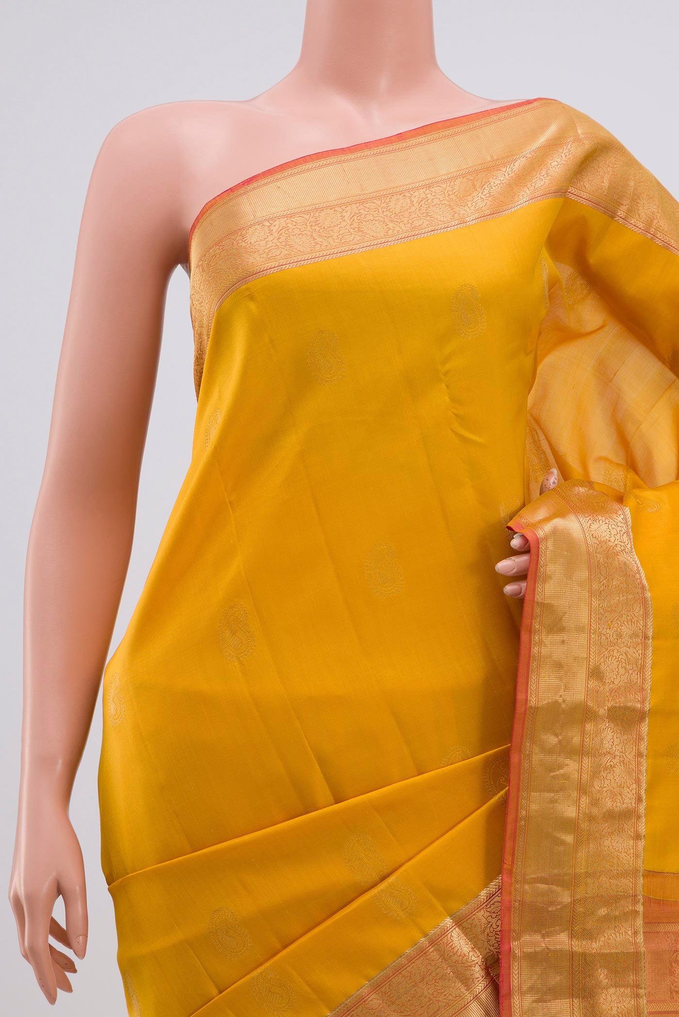 Border image of Yellow Kanchipuram Silk Saree with Zari Butta on the body and Zari Border. 