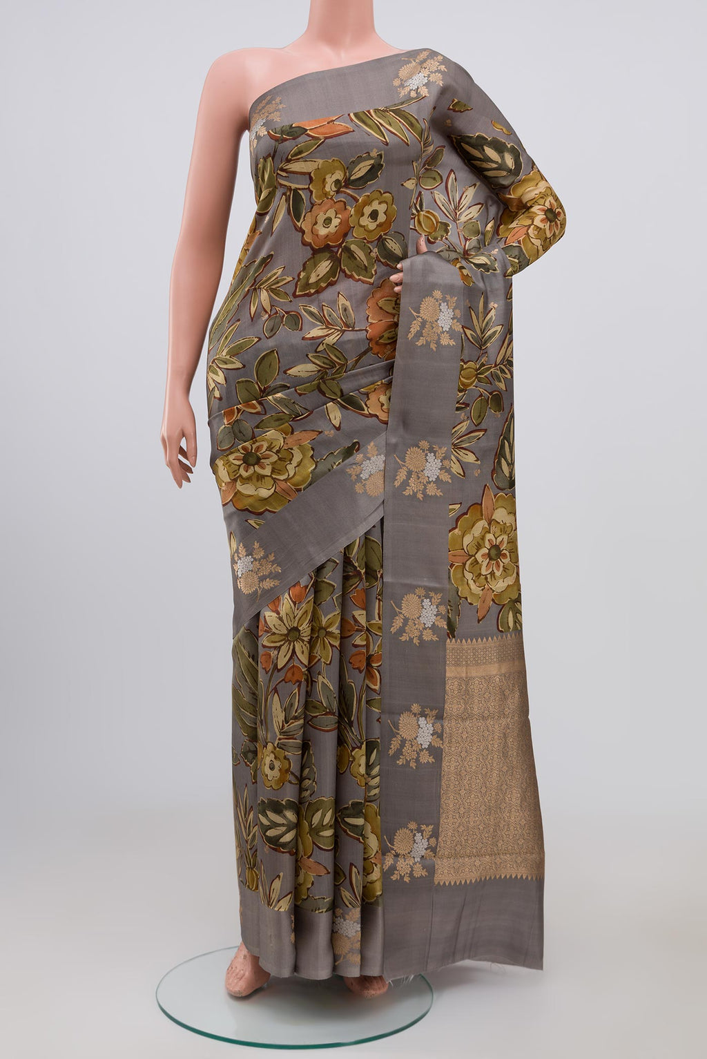 Grey Banarasi Saree with Fancy on the body and Fancy Border.  displayed on a mannequin
