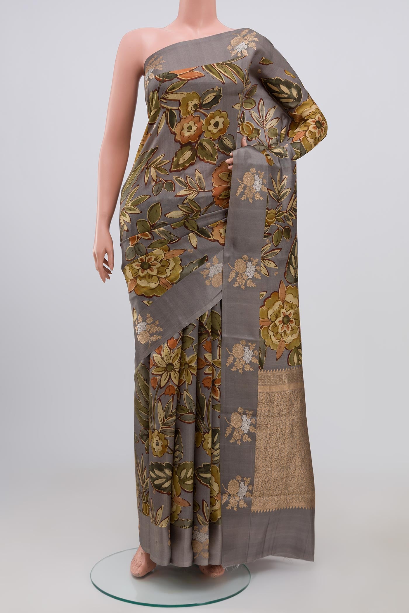 Grey Banarasi Saree with Fancy on the body and Fancy Border.  displayed on a mannequin