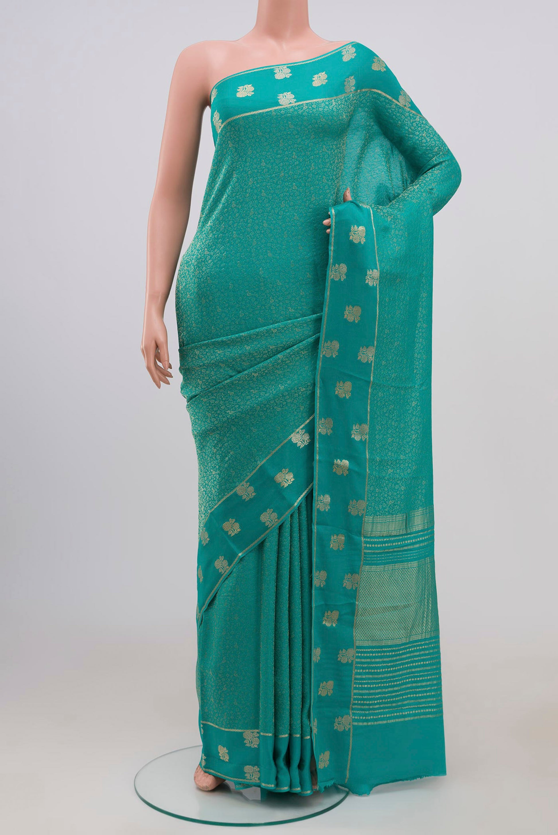 Sky Blue Mysore Georgette Saree with Zari Brocade on the body and Fancy Border.  displayed on a mannequin