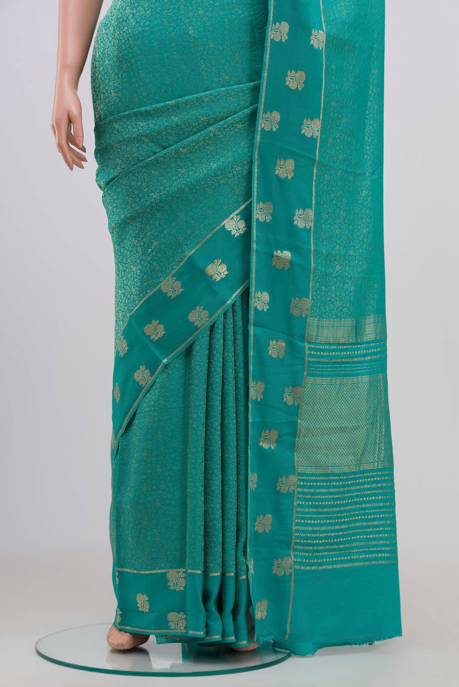 Pleats and pallu of Sky Blue Mysore Georgette Saree with Zari Brocade on the body and Fancy Border. 