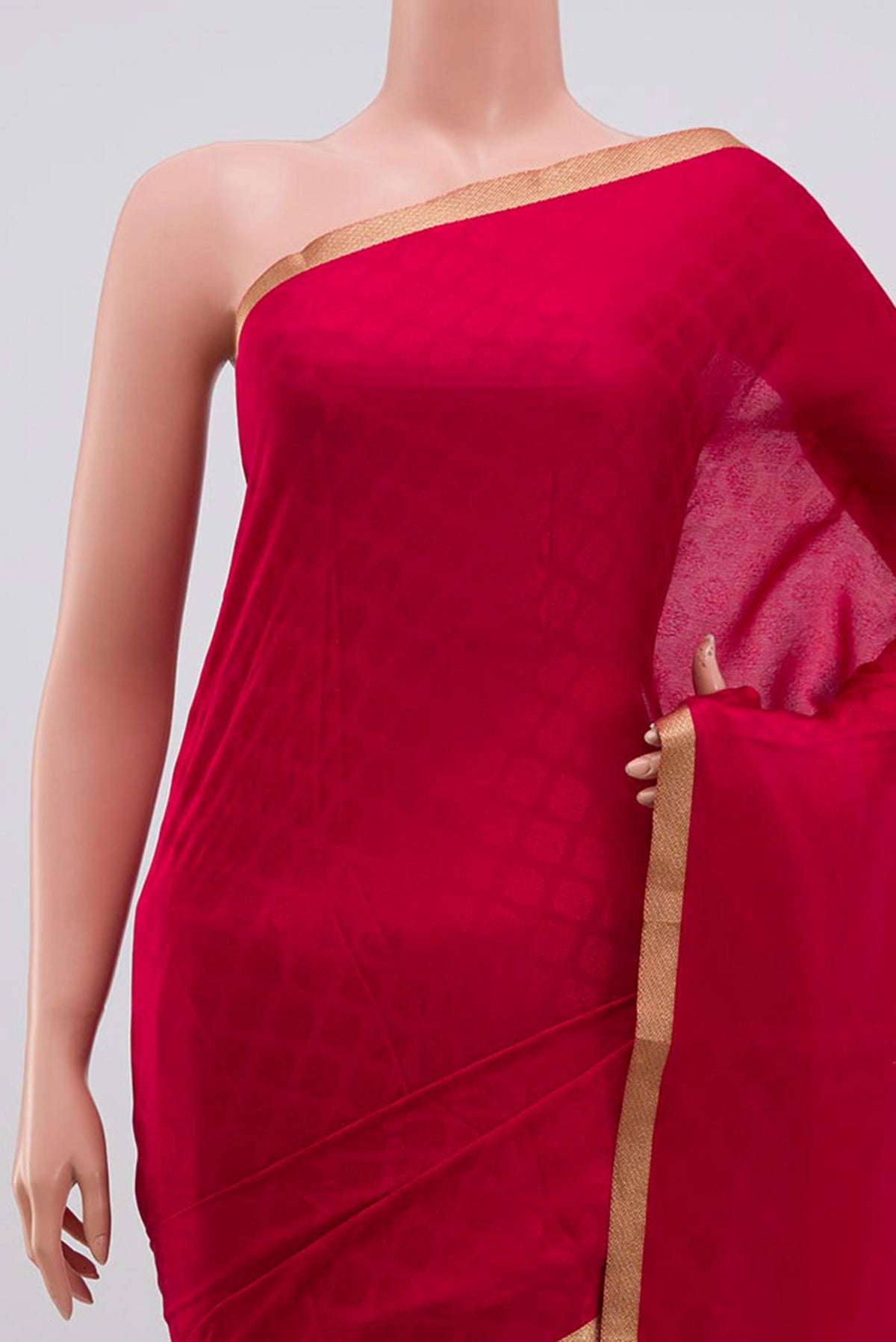 Border image of Pink Crepe Saree with Jacquard design on the body and Zari Border. 