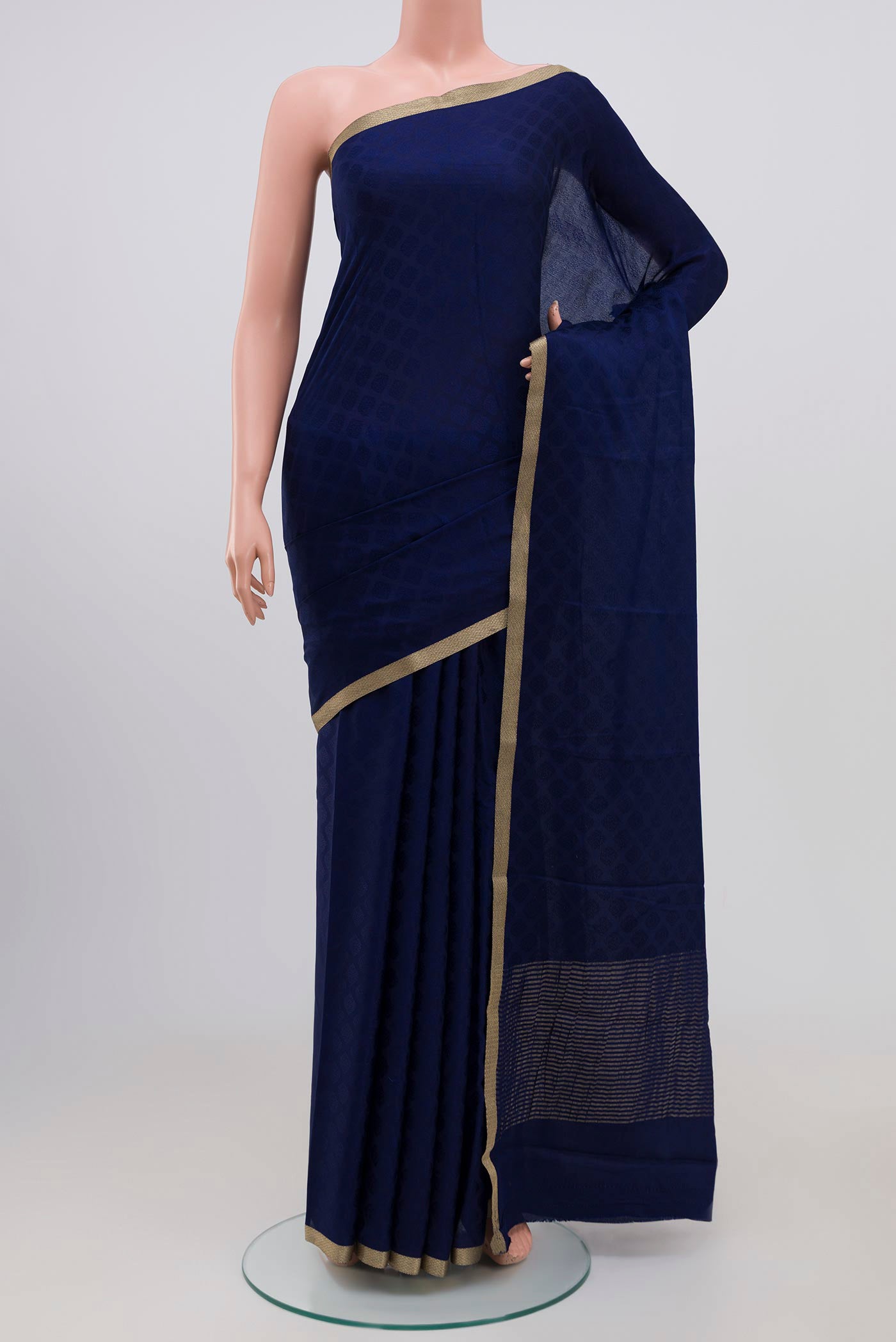 Navy Blue Mysore Silk Saree with Jacquard design on the body and Zari Border.  displayed on a mannequin