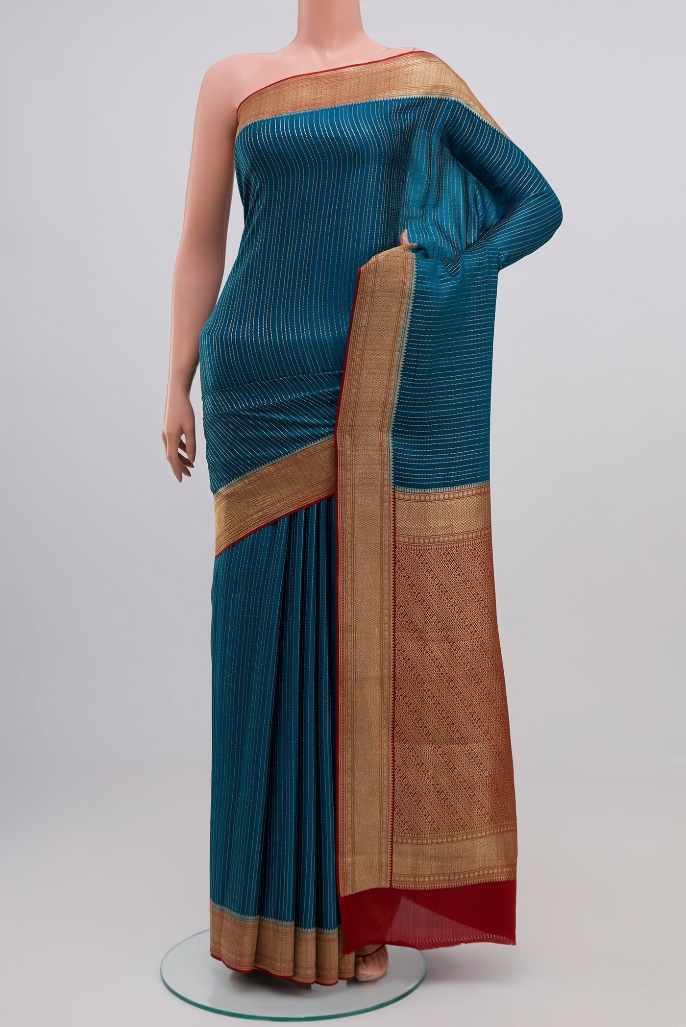 Blue Mysore Crepe Saree with Stripes on the body and Zari Border.  displayed on a mannequin