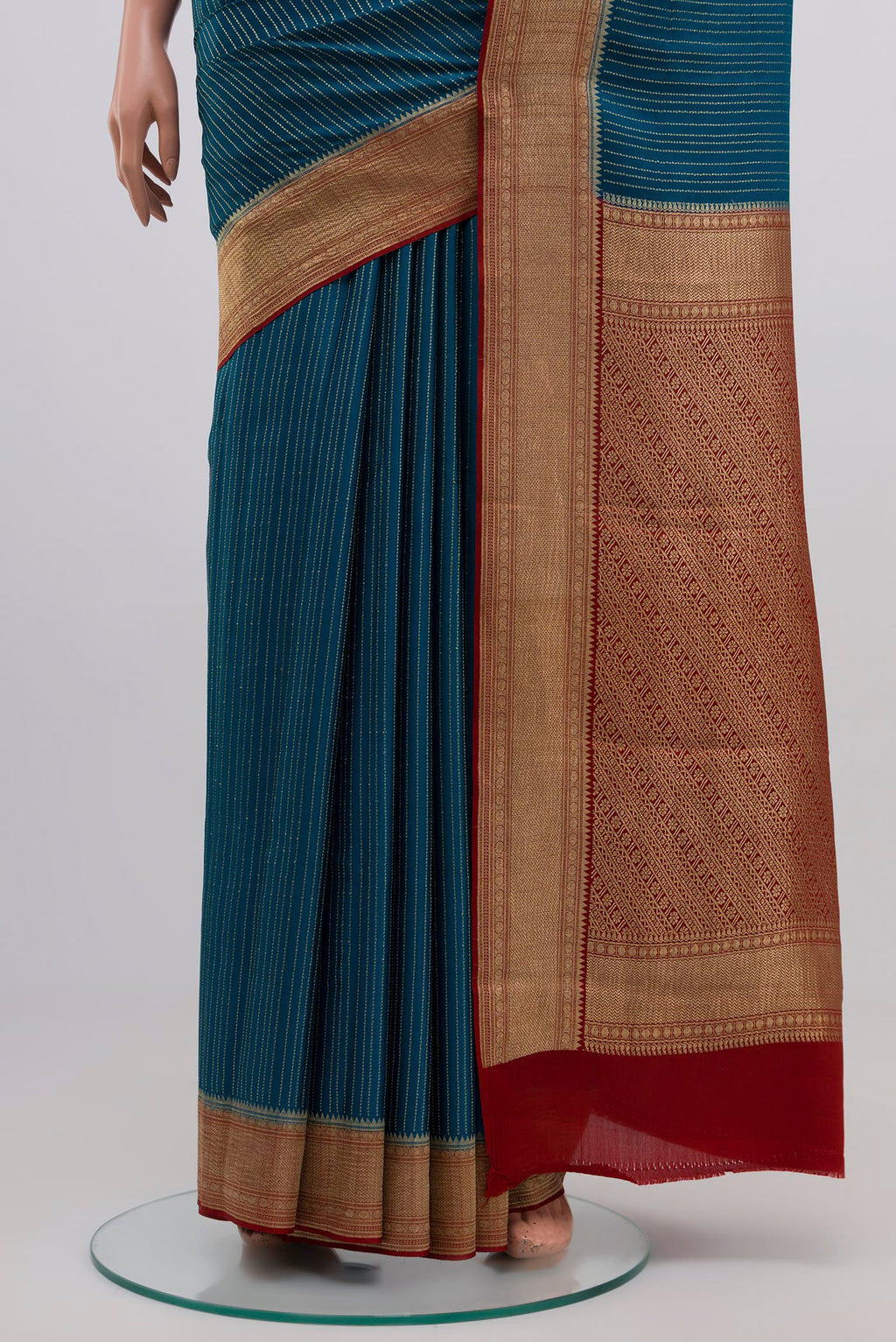 Pleats and pallu of Blue Mysore Crepe Saree with Stripes on the body and Zari Border. 