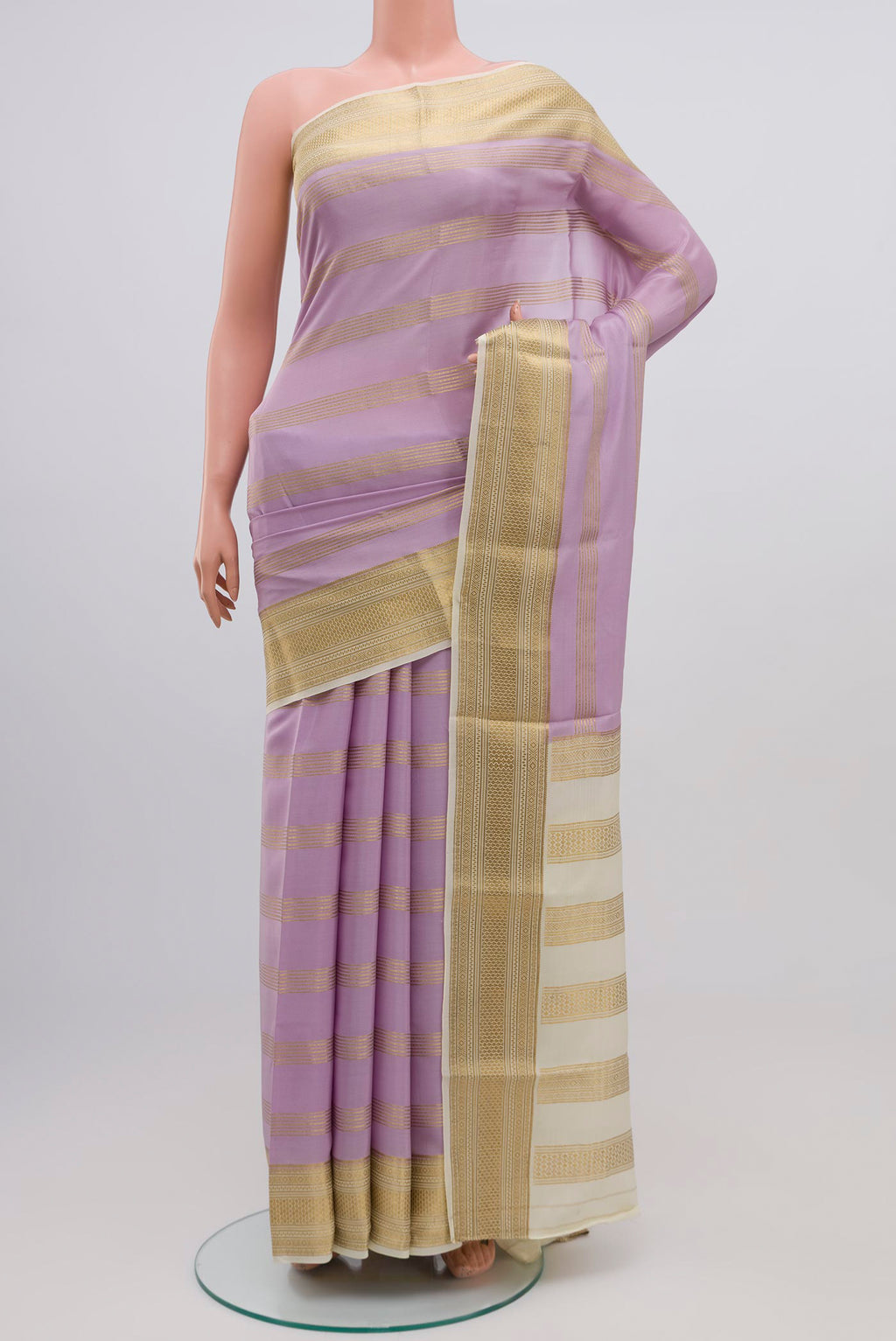 Lavender Mysore Crepe Saree with Stripes on the body and Zari Border.  displayed on a mannequin