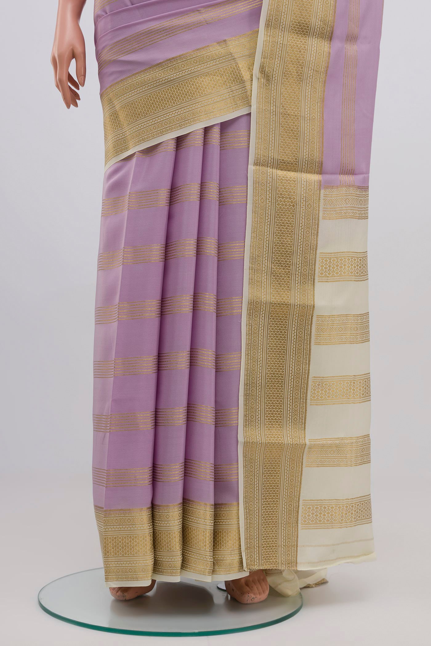 Pleats and pallu of Lavender Mysore Crepe Saree with Stripes on the body and Zari Border. 
