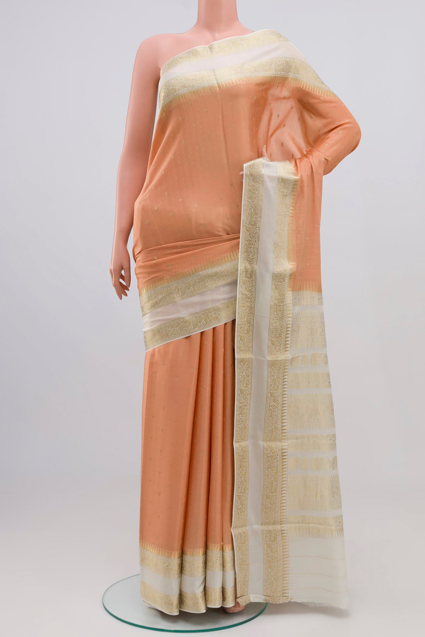 Peach Mysore Crepe Saree with Jacquard With Zari Butta on the body and Zari Border.  displayed on a mannequin