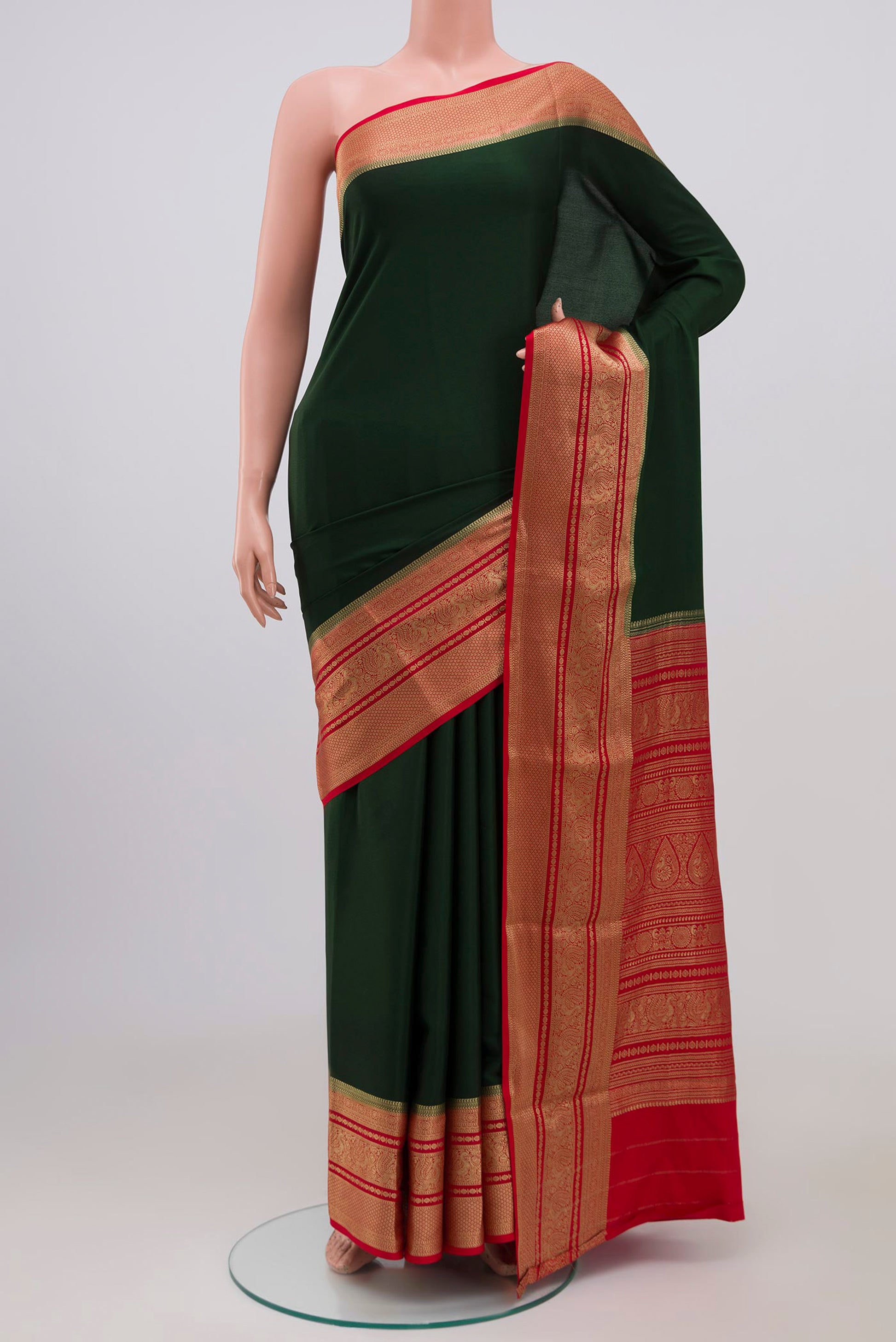 Green Mysore Crepe Saree with Plain Body and Zari Border.  displayed on a mannequin