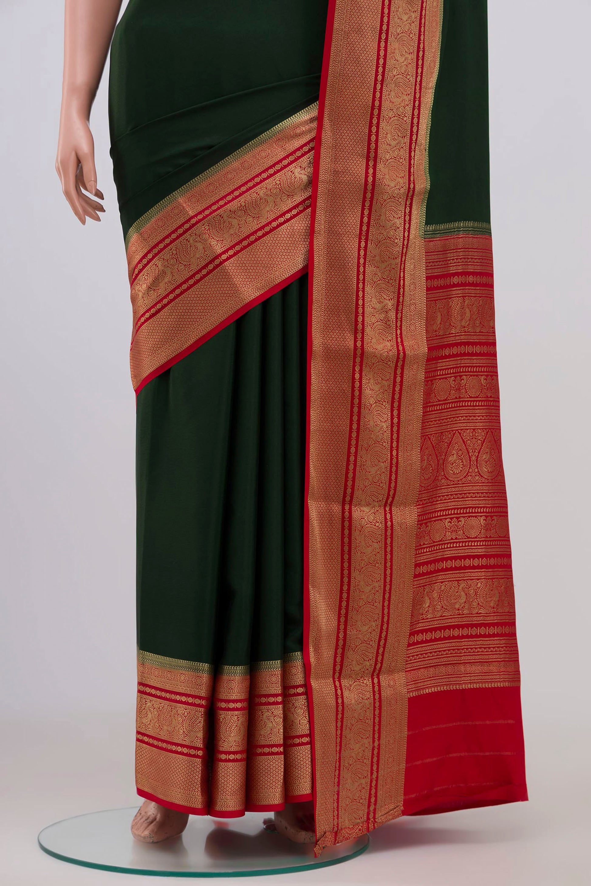Pleats and pallu of Green Mysore Crepe Saree with Plain Body and Zari Border. 