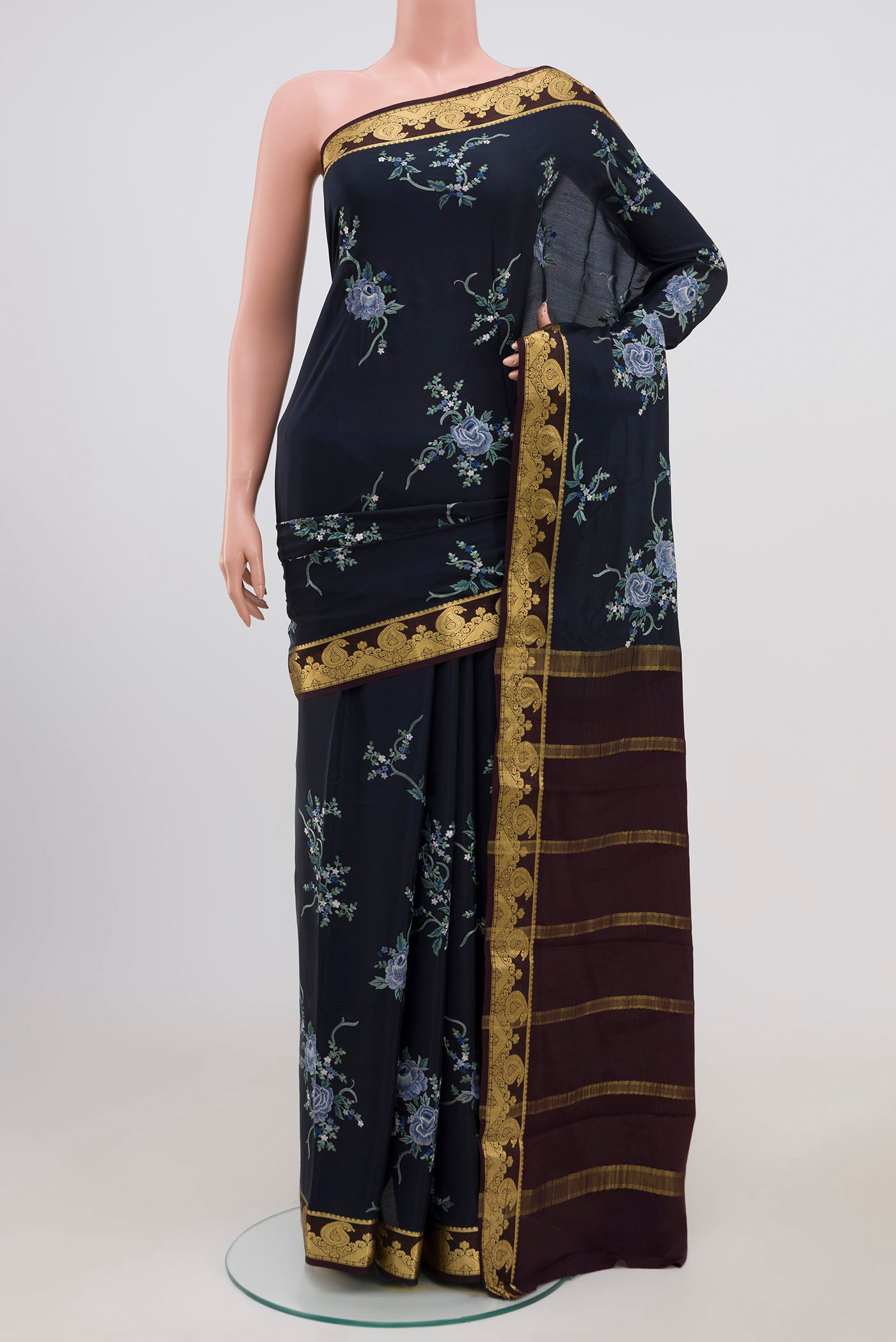 Blue Mysore Crepe Saree with Fancy on the body and Zari Border.  displayed on a mannequin