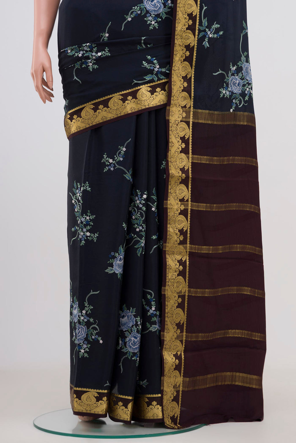 Pleats and pallu of Blue Mysore Crepe Saree with Fancy on the body and Zari Border. 