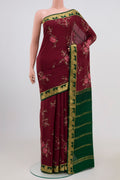 Maroon Mysore Crepe Saree with Fancy on the body and Zari Border.  displayed on a mannequin