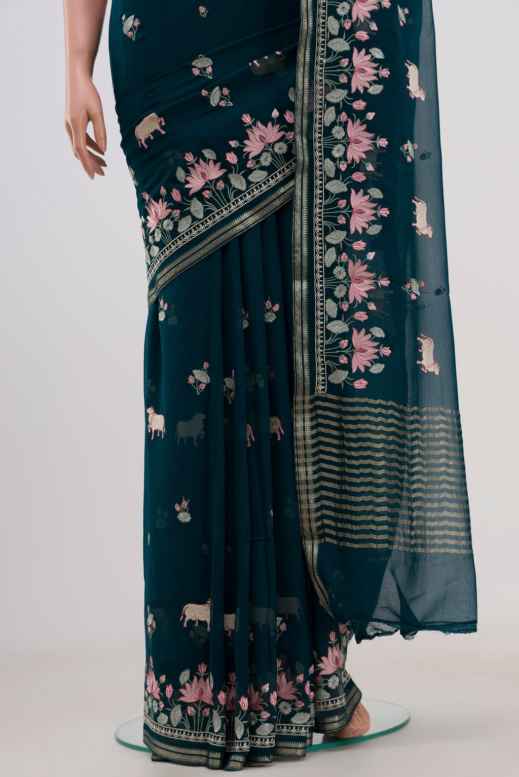 Pleats and pallu of Blue Chiffon Saree with Embroidery on the body and Fancy Border. 