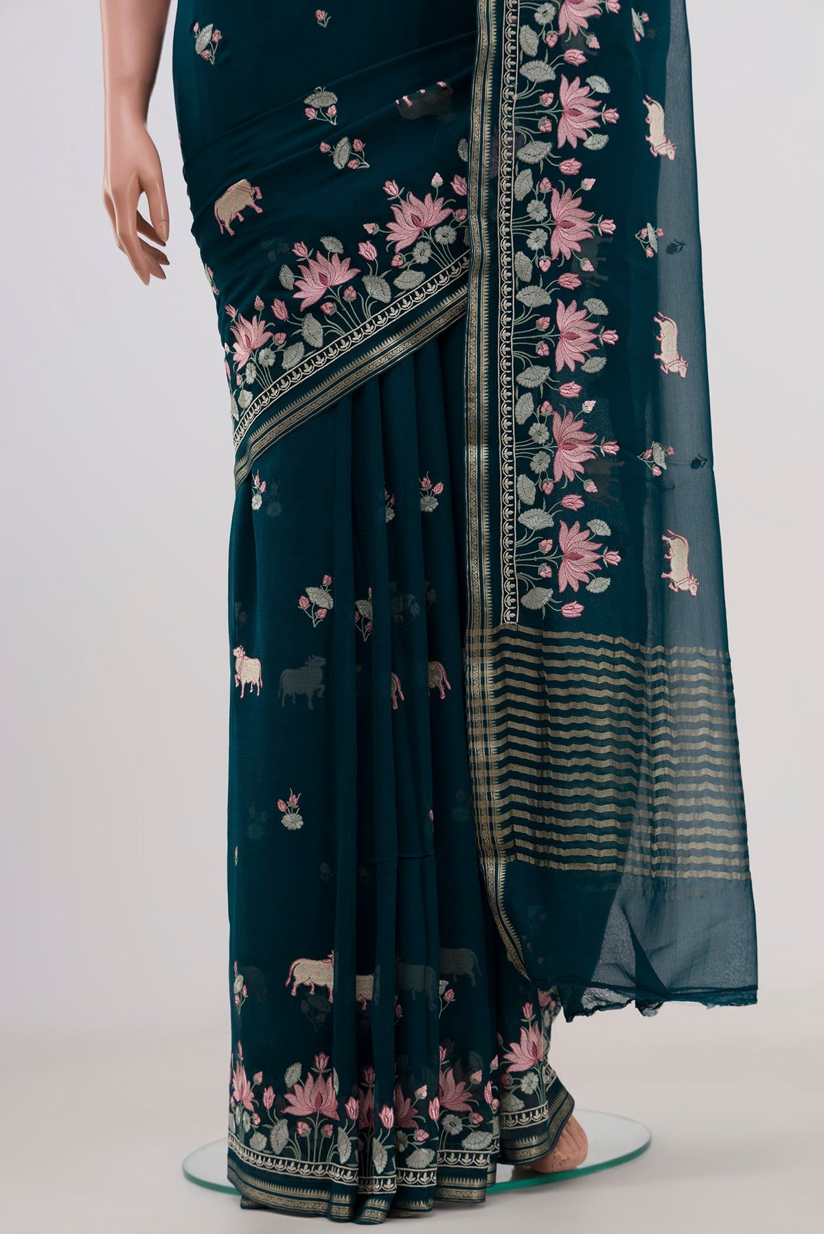 Pleats and pallu of Blue Chiffon Saree with Embroidery on the body and Fancy Border. 