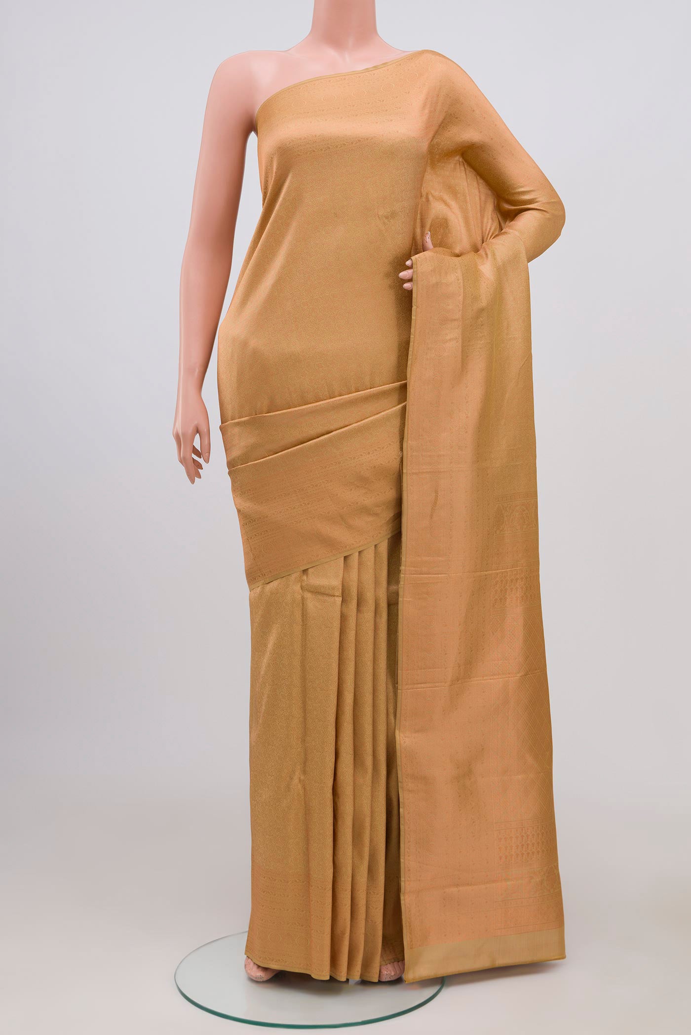 Cream Kanchipuram Silk Saree with Zari Brocade on the body and Zari Border.  displayed on a mannequin