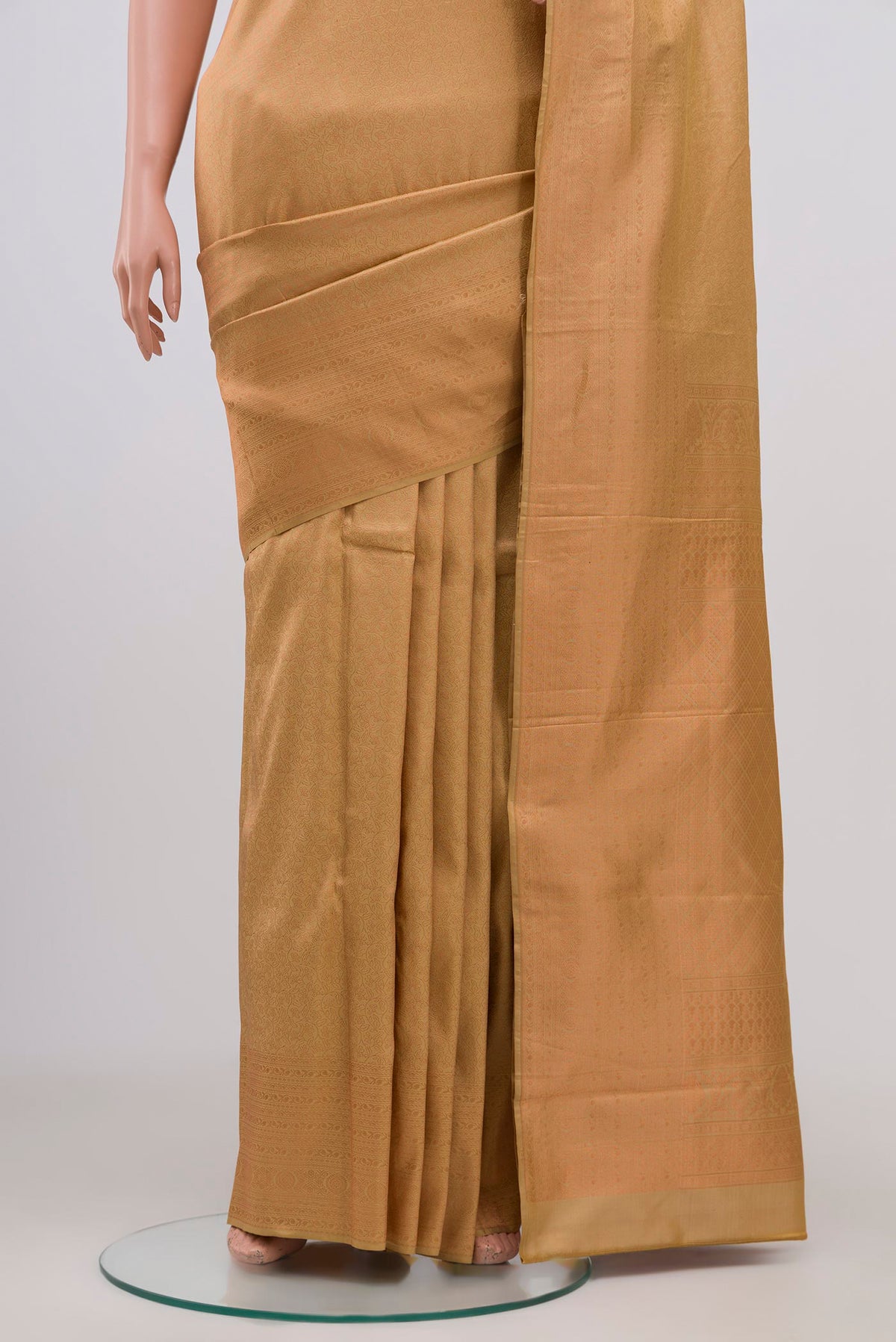 Pleats and pallu of Cream Kanchipuram Silk Saree with Zari Brocade on the body and Zari Border. 