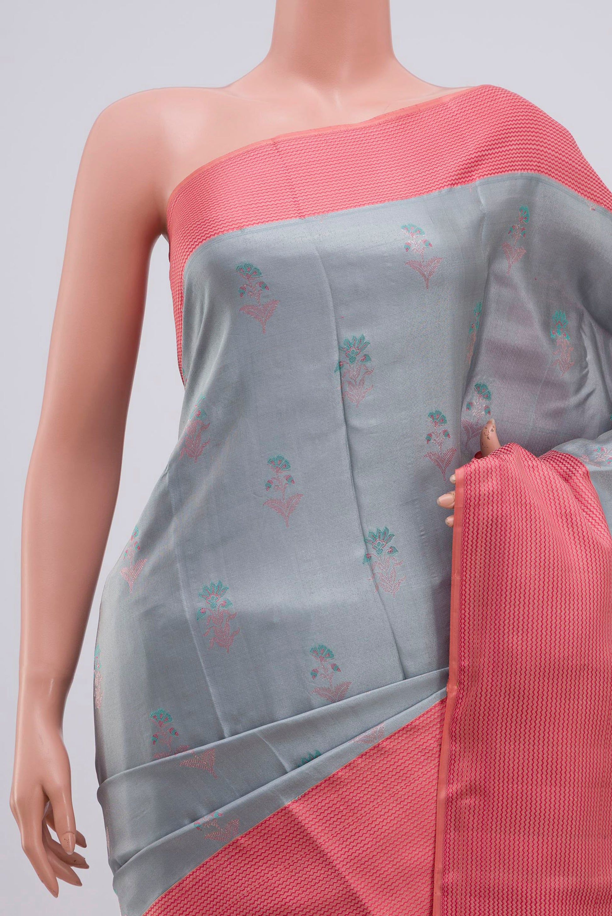 Border image of Grey Kanchipuram Silk Saree with Zari Butta on the body and Thin Zari Line. 