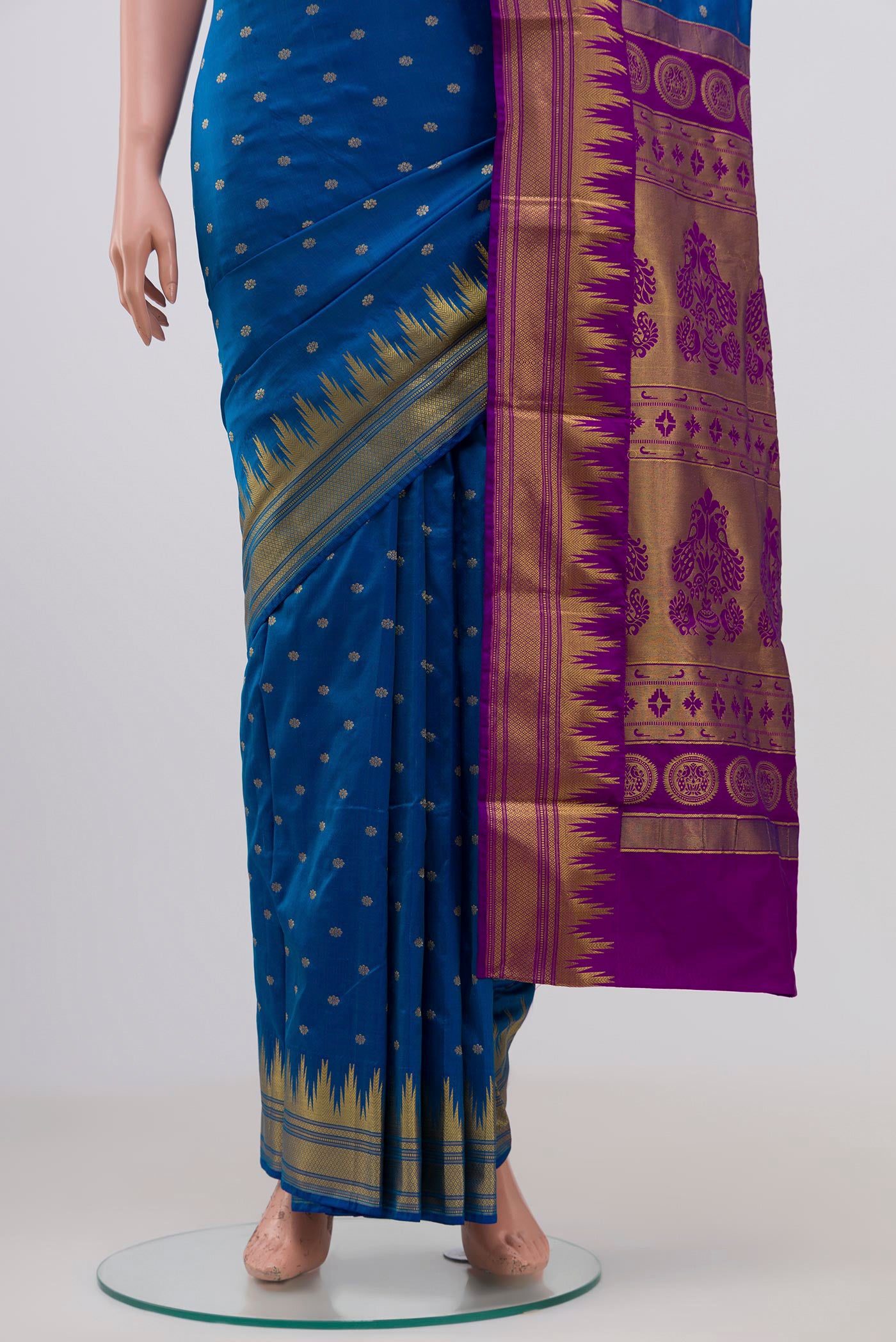 Pleats and pallu of Blue Blended Bangalore Silk Saree with Zari Butta on the body and Zari Border. 