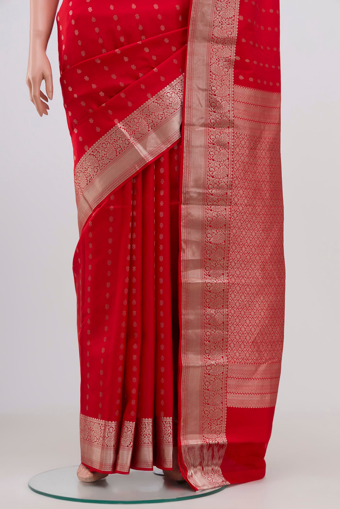 Pleats and pallu of Red Kanchipuram Silk Saree with Zari Butta on the body and Zari Border. 