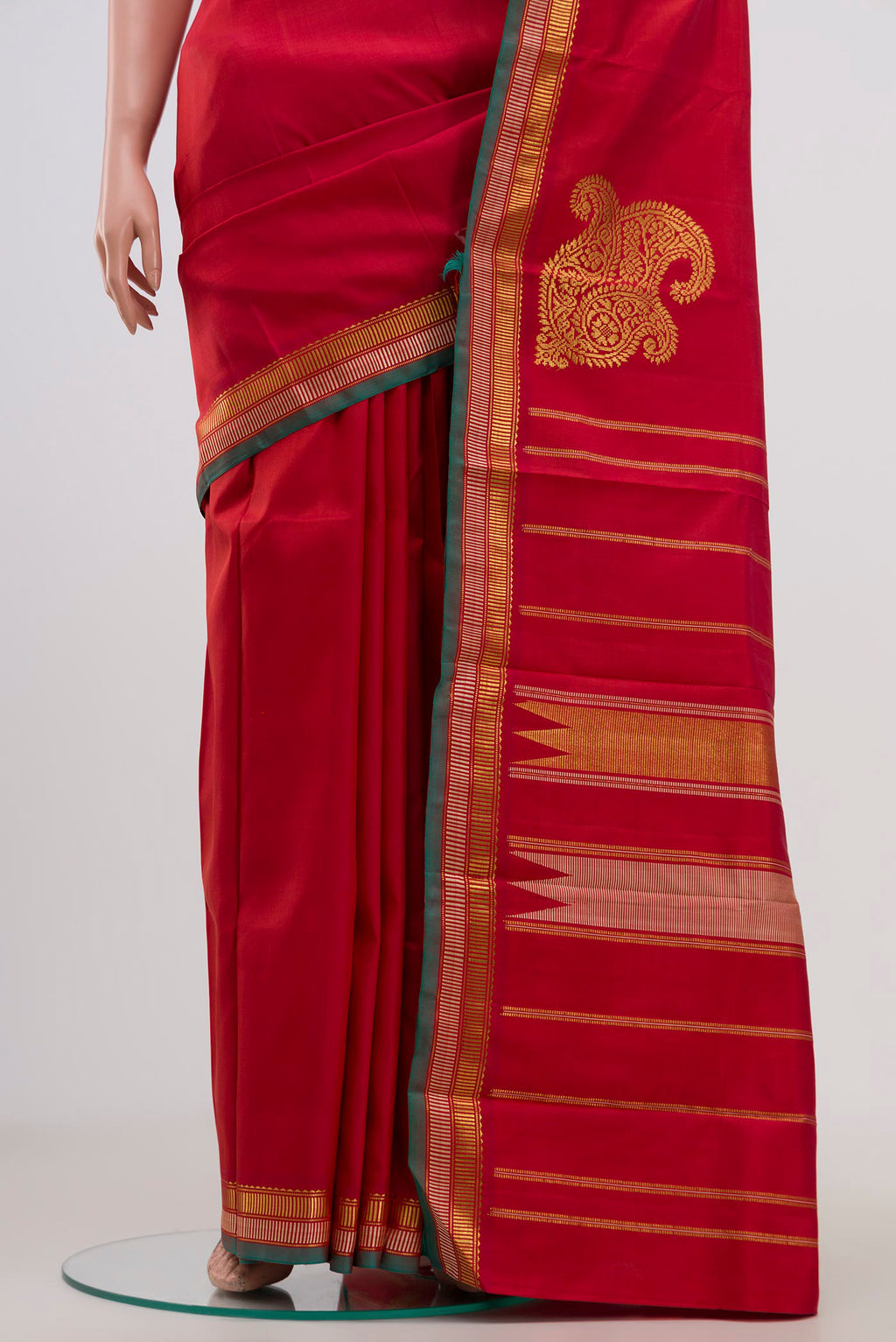 Pleats and pallu of Pure Silk Pure Zari Red Kanjivaram Saree with Plain Body and Zari Border. 