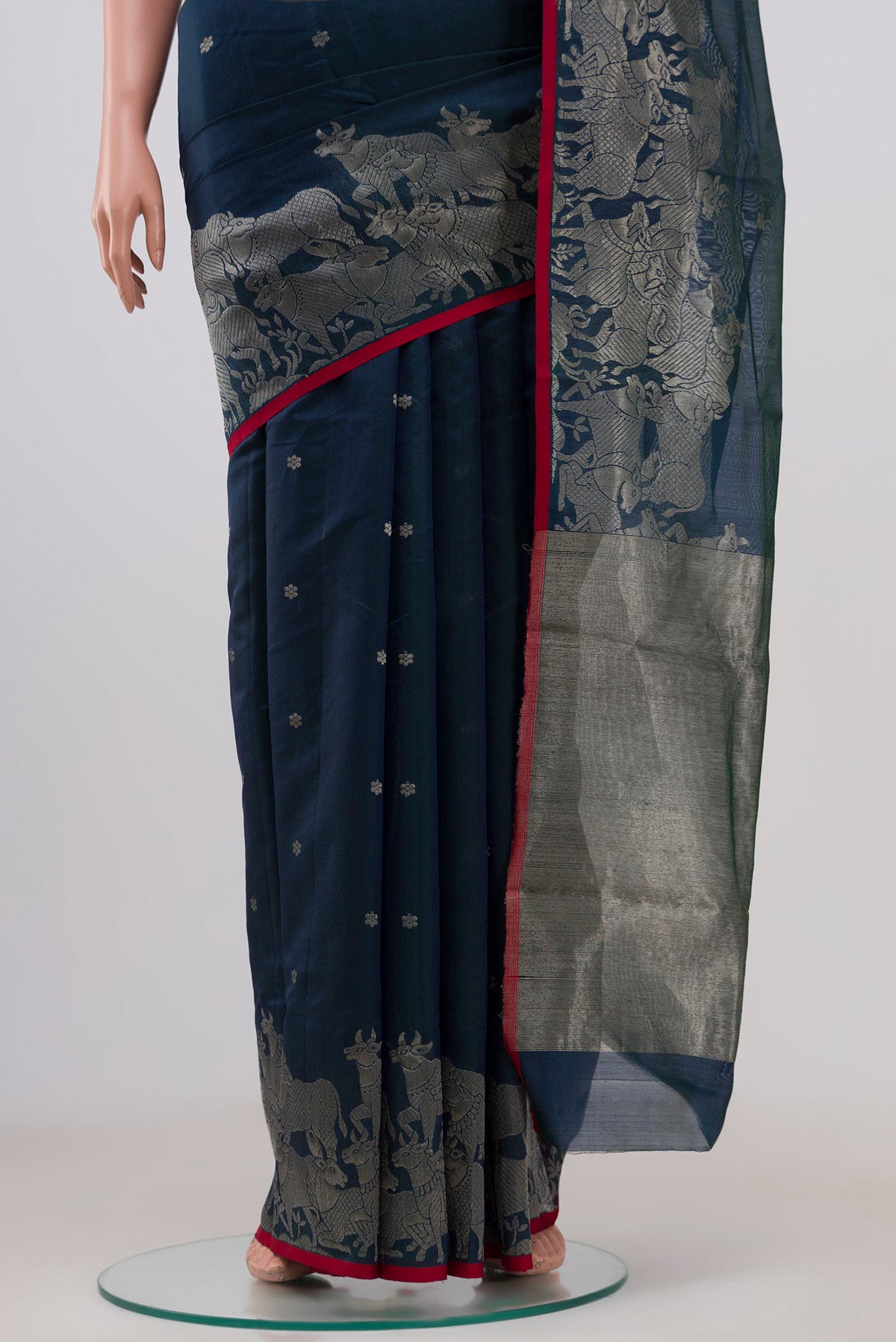Pleats and pallu of Navy Blue Chanderi Silk Cotton Saree with Zari Butta on the body and Fancy Border. 