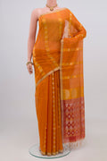 Orange Silk Cotton Saree with Zari Butta on the body and Thin Zari Line.  displayed on a mannequin