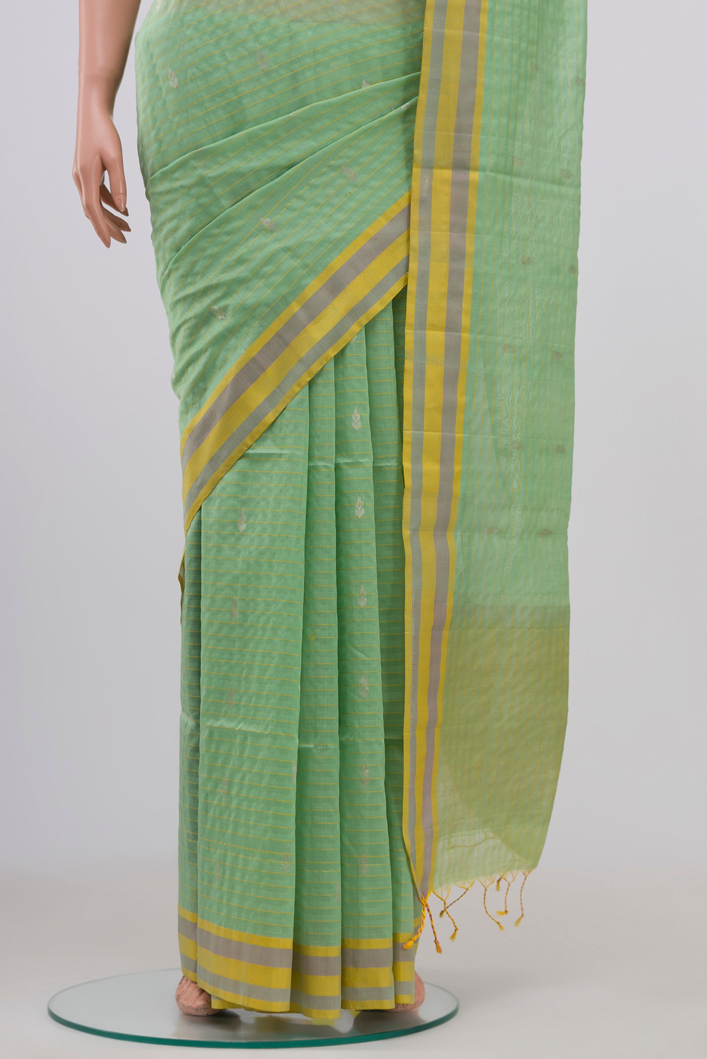 Pleats and pallu of Light Green Coimbatore Silk Cotton Saree with Zari Butta on the body and Thread Border. 