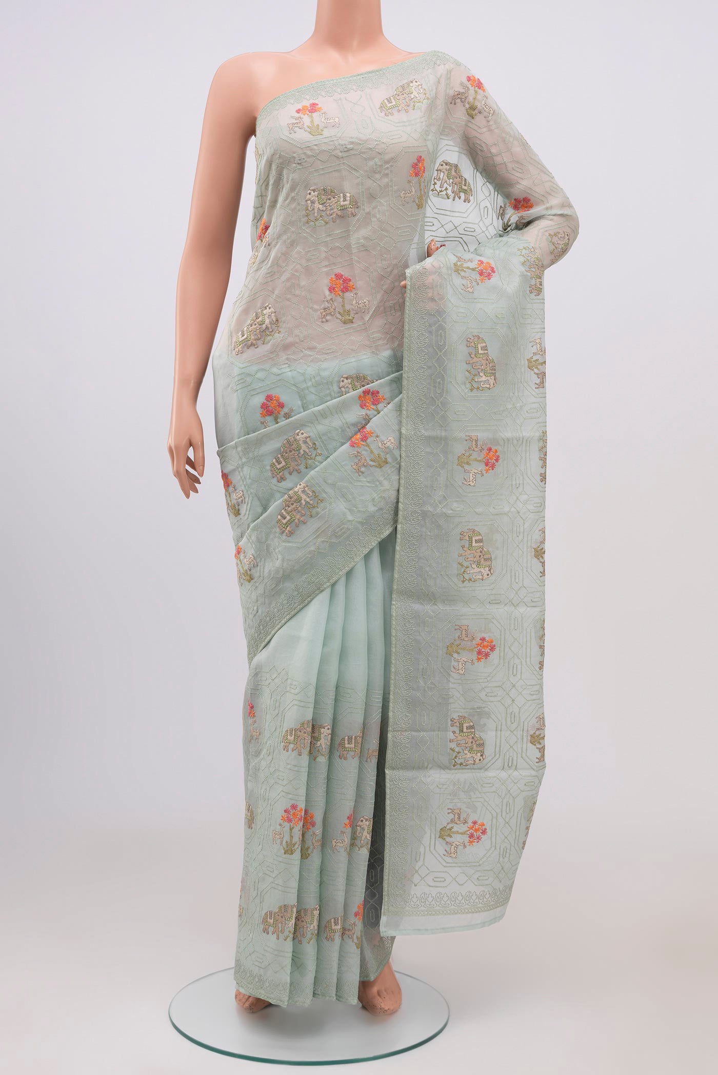 Light Blue Organza Silk Saree with Fancy on the body and Without Border.  displayed on a mannequin