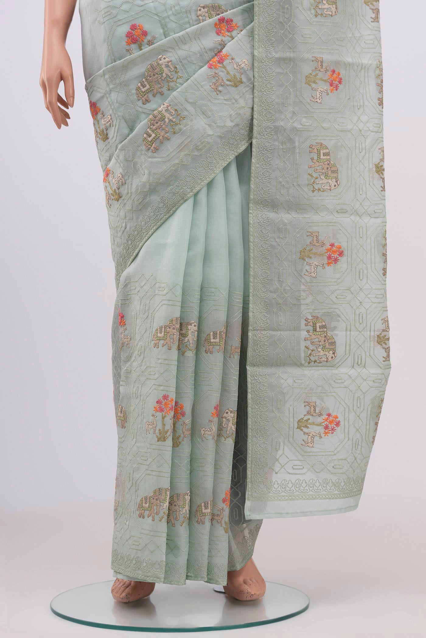 Pleats and pallu of Light Blue Organza Silk Saree with Fancy on the body and Without Border. 