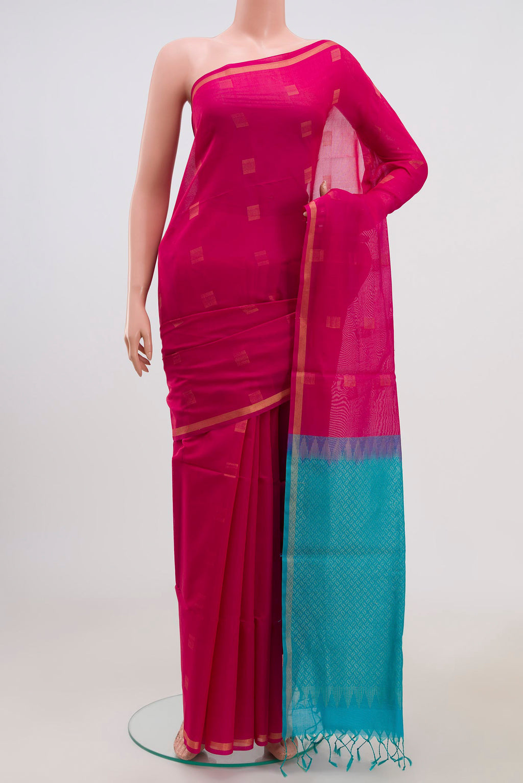 Pink Coimbatore Silk Cotton Saree with Zari Butta on the body and Thin Zari Line.  displayed on a mannequin