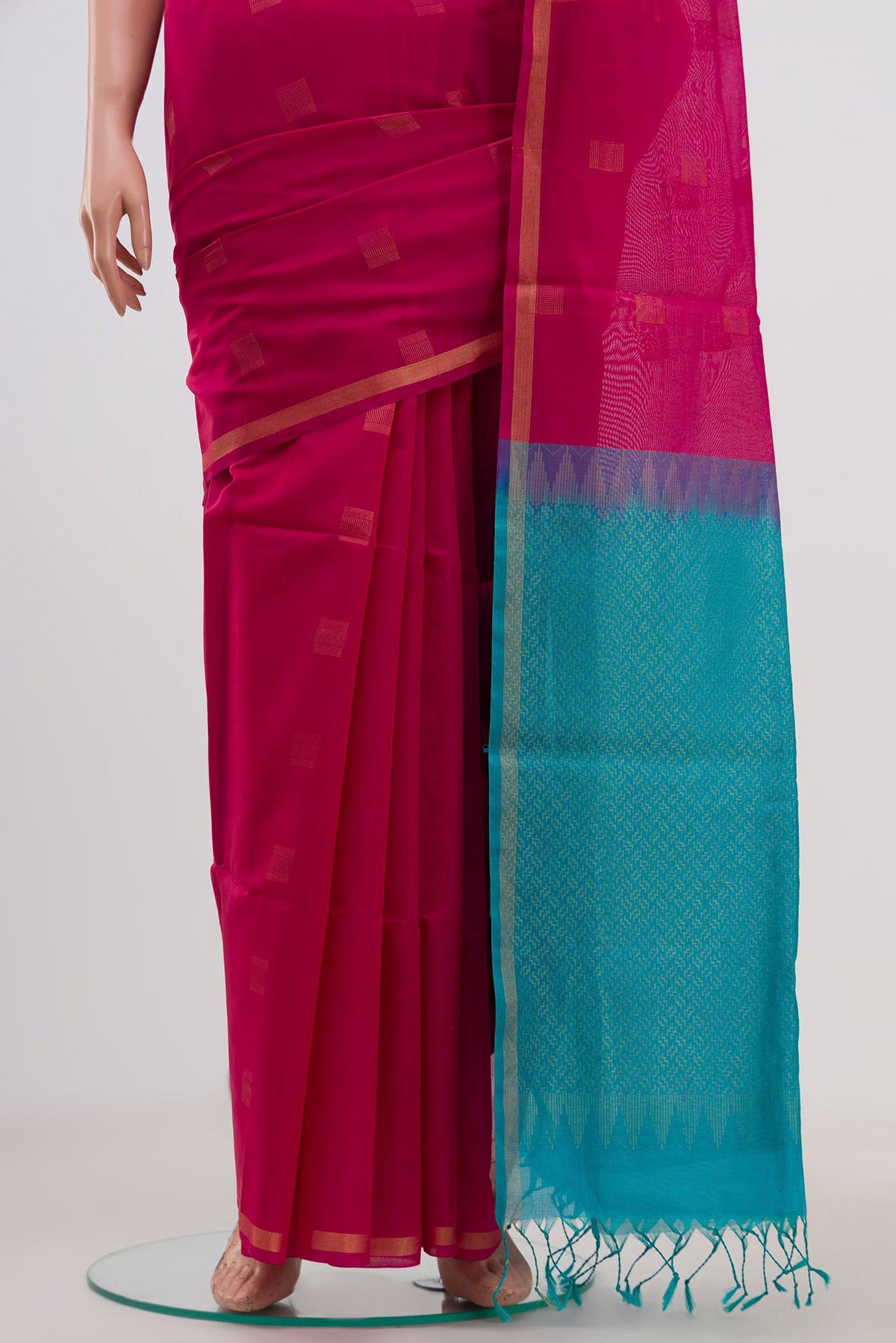 Pleats and pallu of Pink Coimbatore Silk Cotton Saree with Zari Butta on the body and Thin Zari Line. 