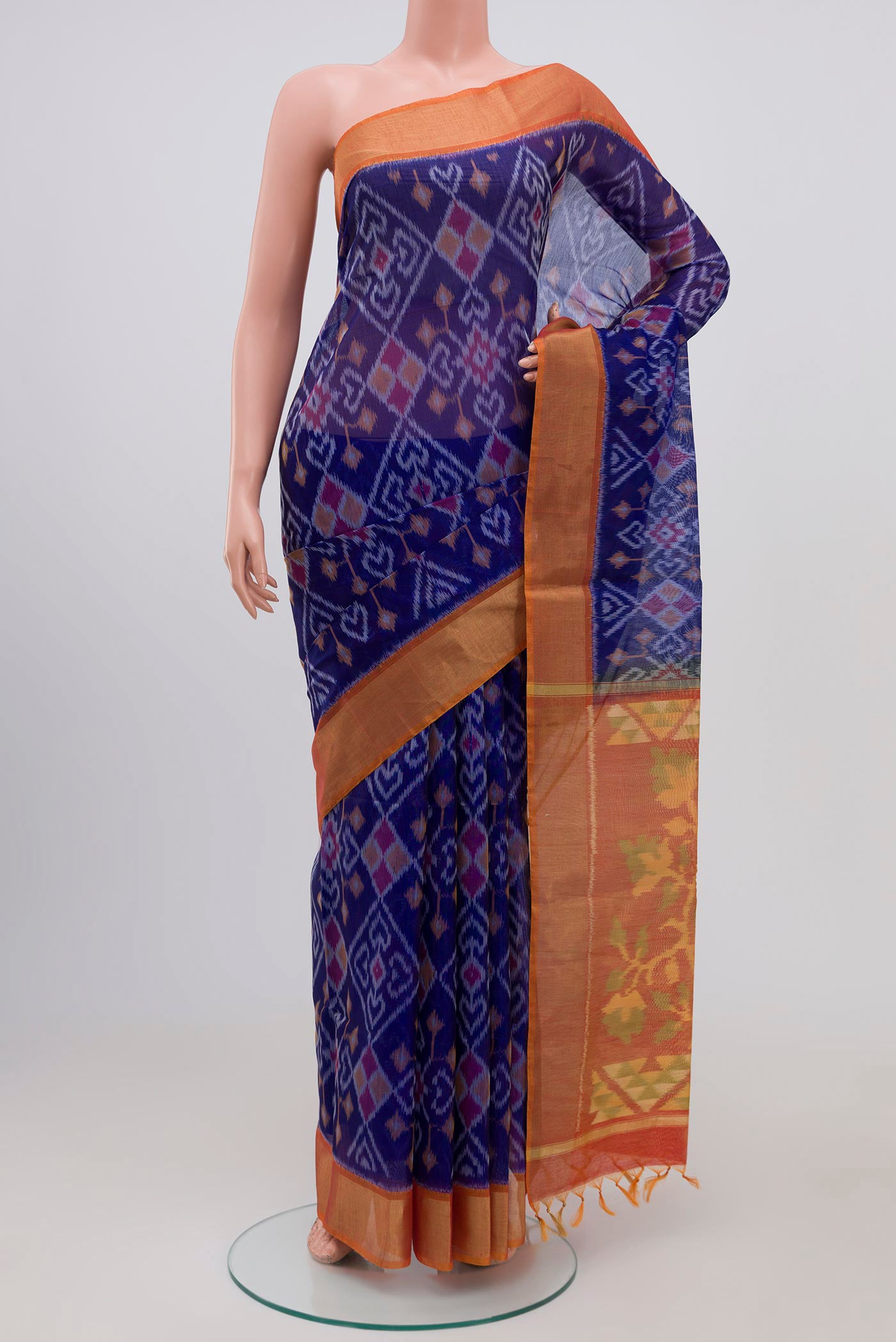 Blue Coimbatore Silk Cotton Saree with Ikat Print on the body and Zari Border.  displayed on a mannequin