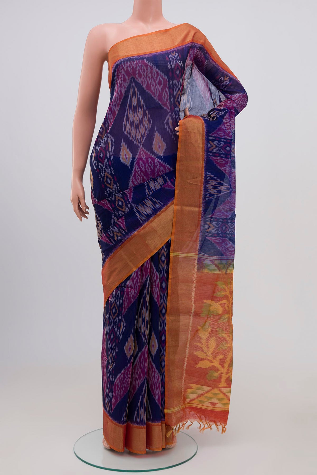 Blue Coimbatore Silk Cotton Saree with Ikat Print on the body and Zari Border.  displayed on a mannequin