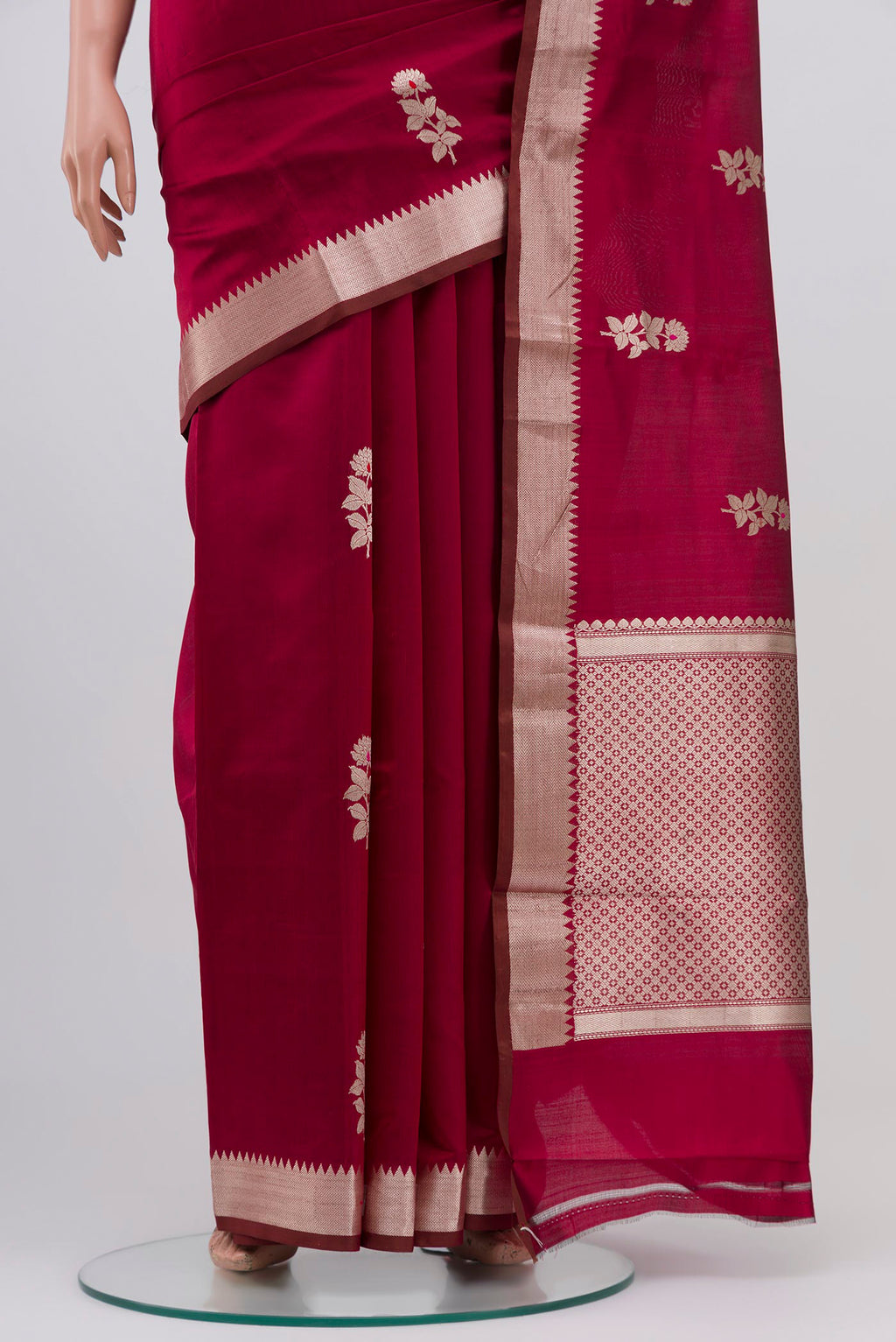Pleats and pallu of Maroon Banarasi Katan Silk Saree with Zari Butta on the body and Zari Border. 